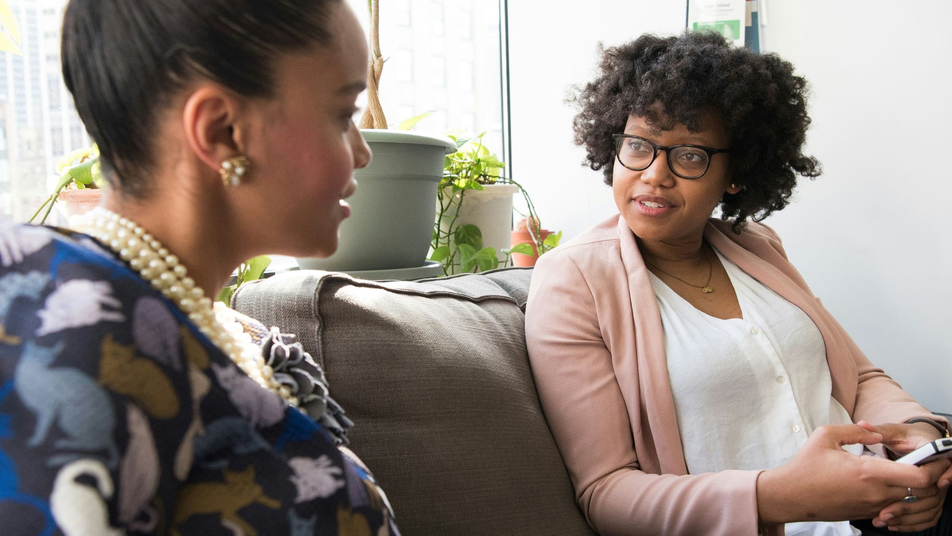 shallow focus photo of woman in beige open cardigan