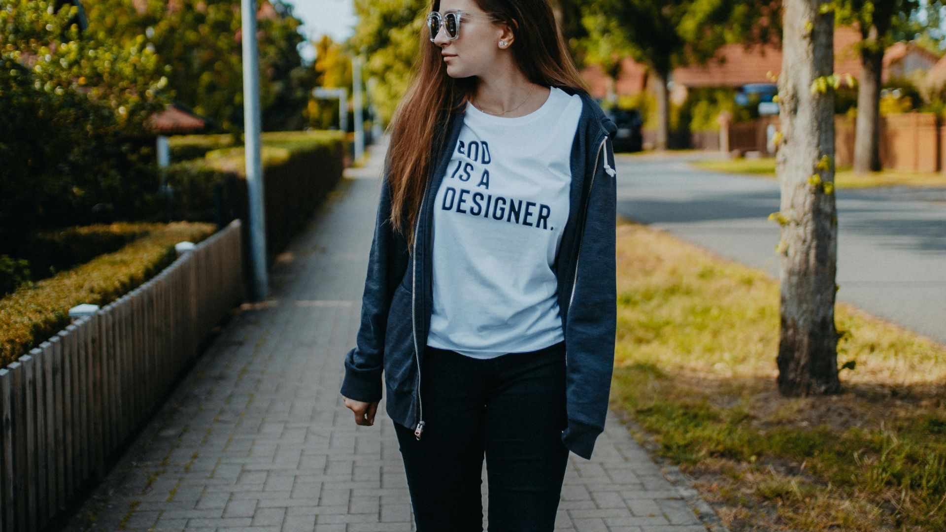 shallow focus photo of woman in black full-zip jacket and pants