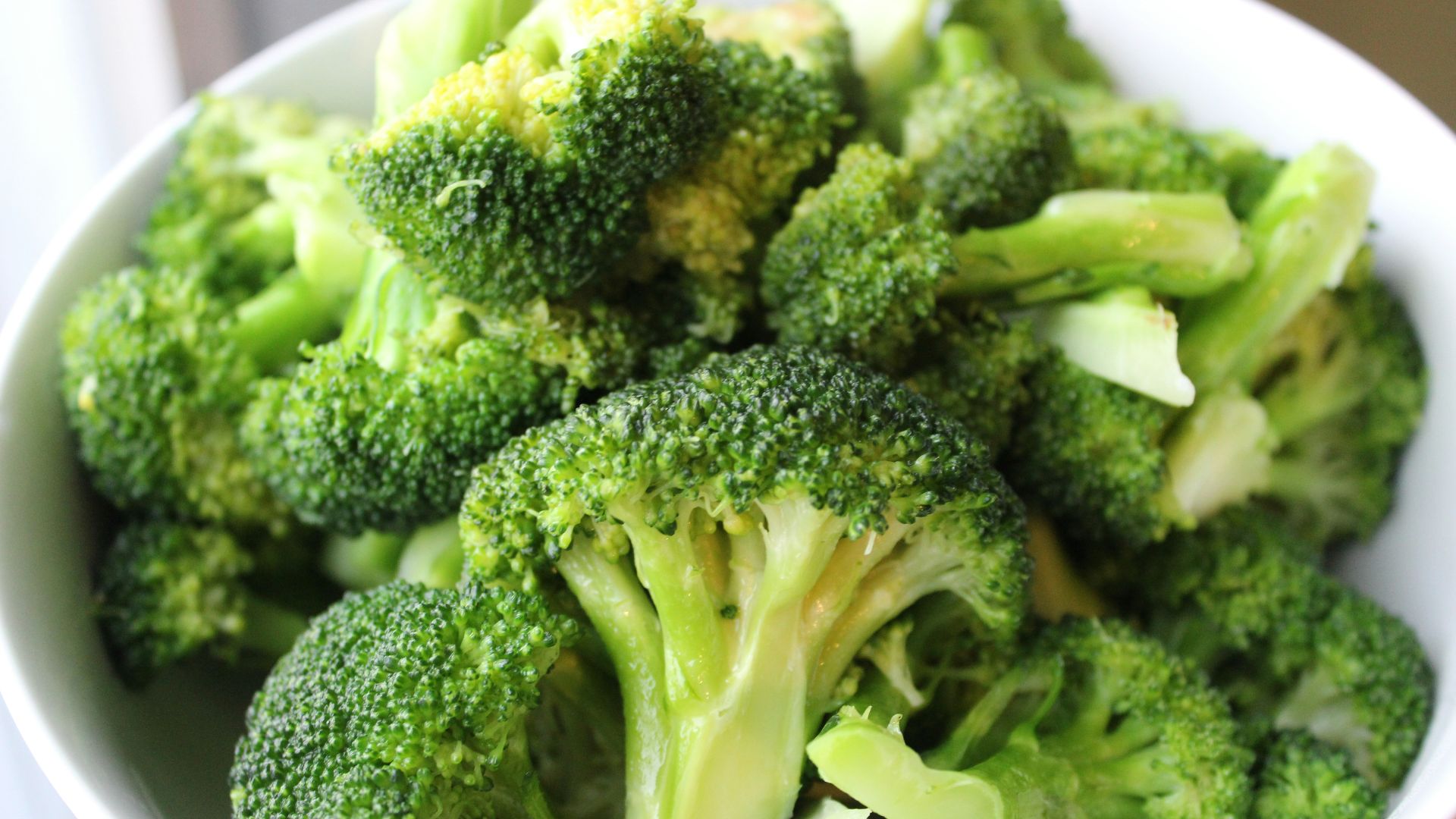 green broccoli on white ceramic plate