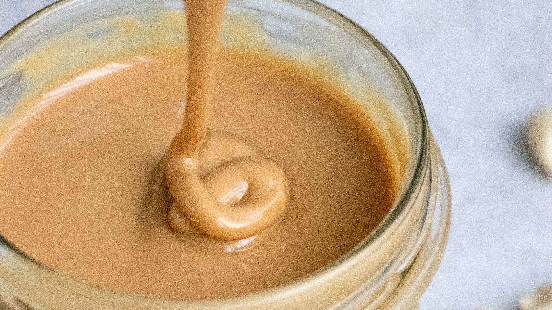 clear glass jar with brown liquid