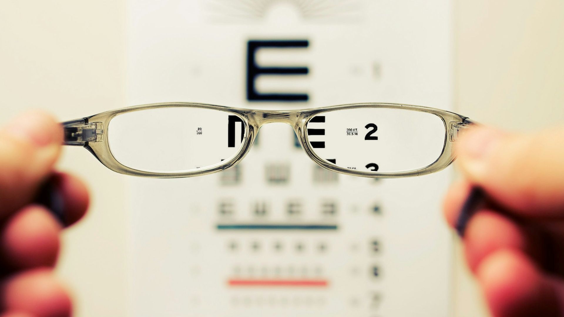person holding eyeglasses