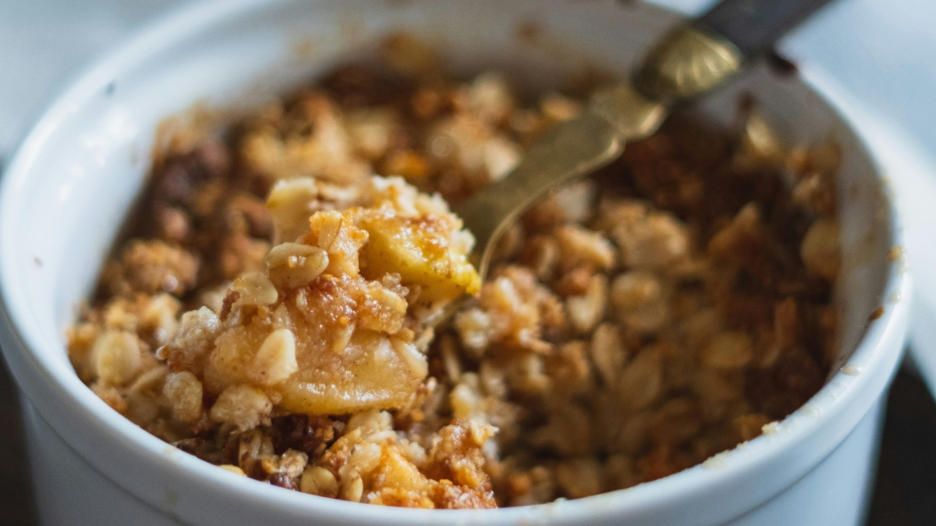 stainless steel spoon on white ceramic bowl