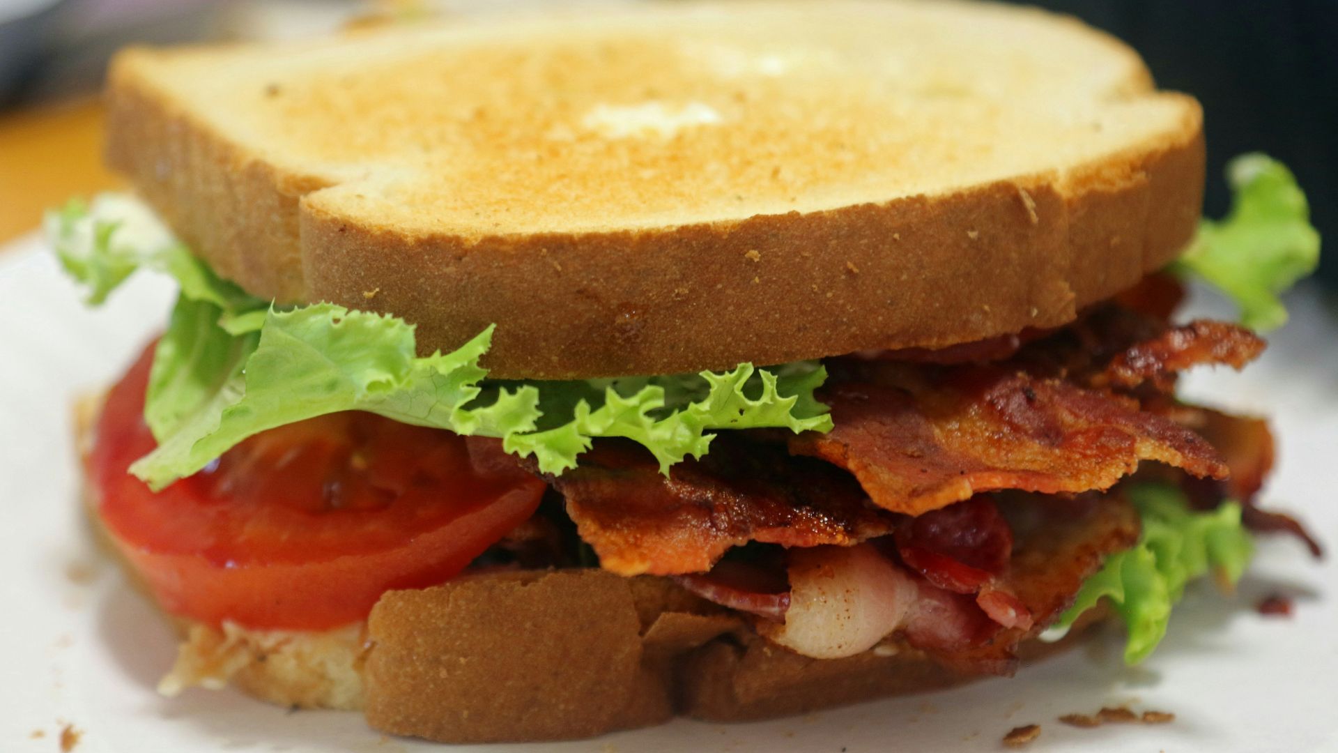 A bacon, tomato and lettuce sandwich on a plate