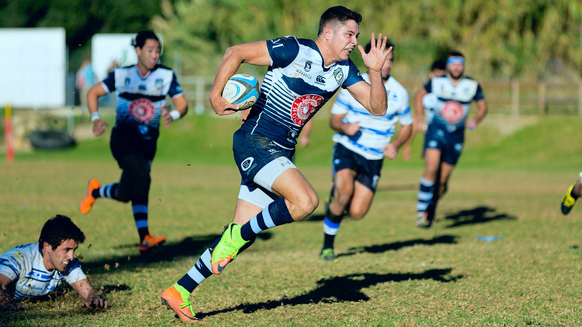 team playing rugby sport