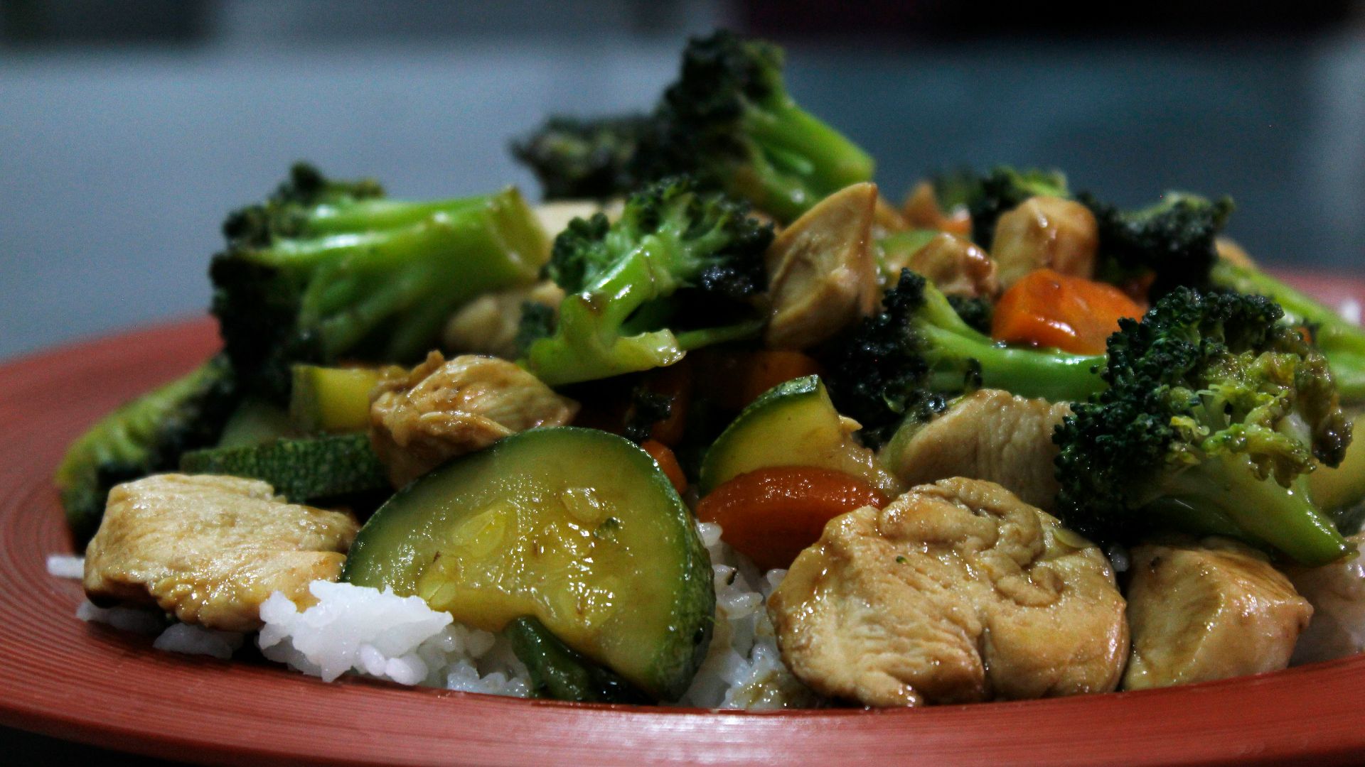 cooked food on red ceramic plate