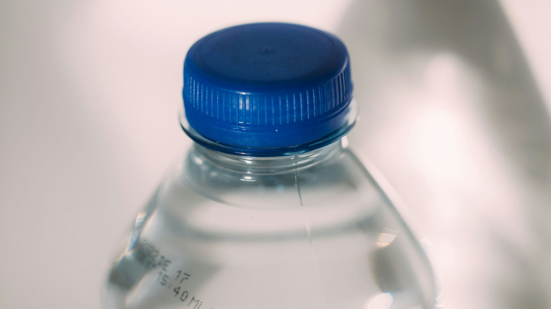blue lid clear plastic bottle