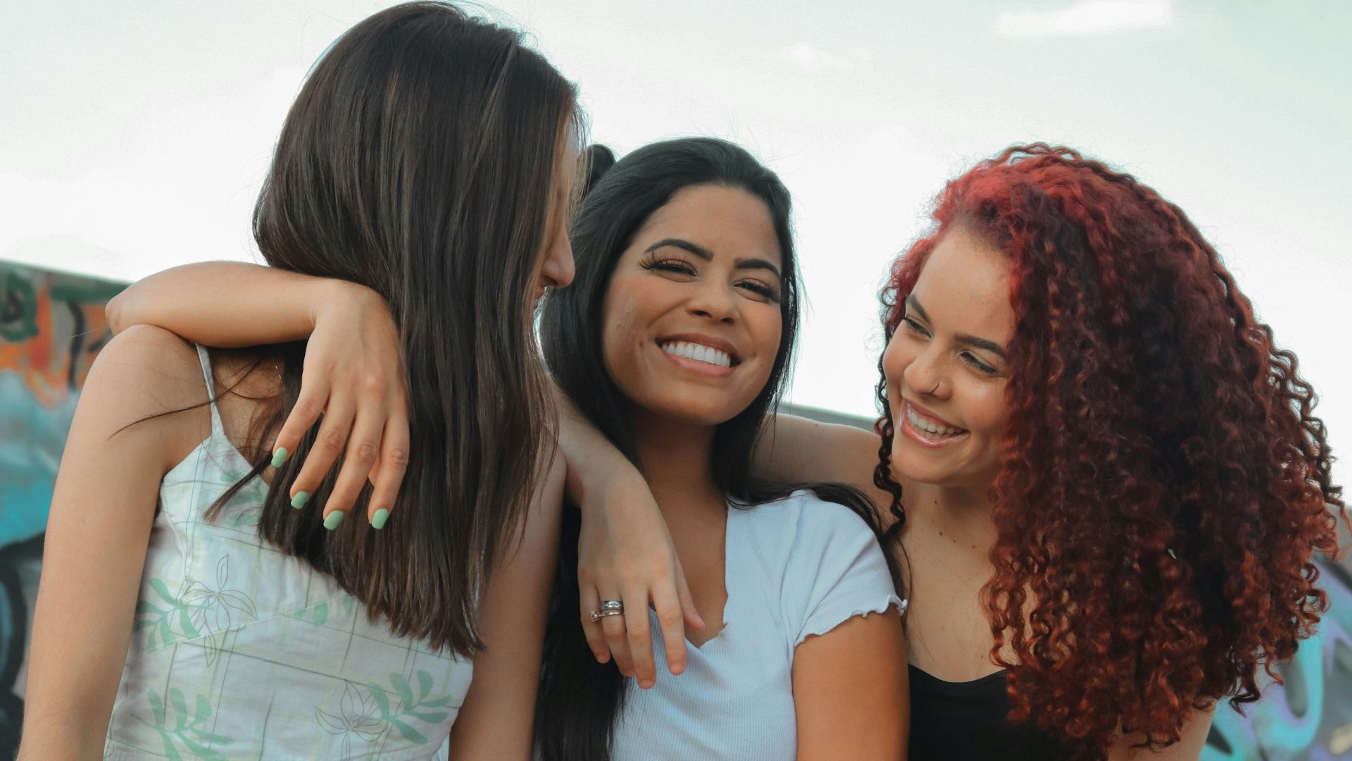 a group of young women standing next to each other