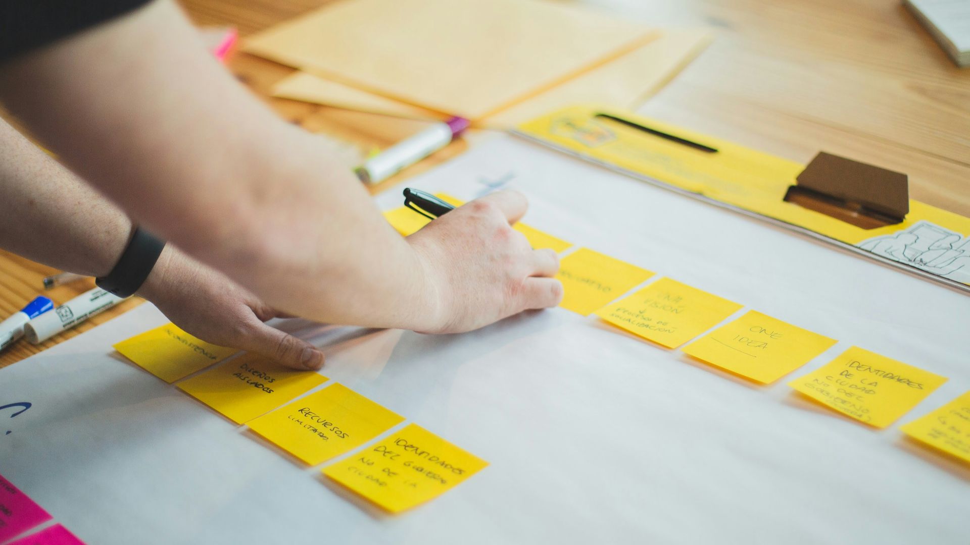 person writing on white paper