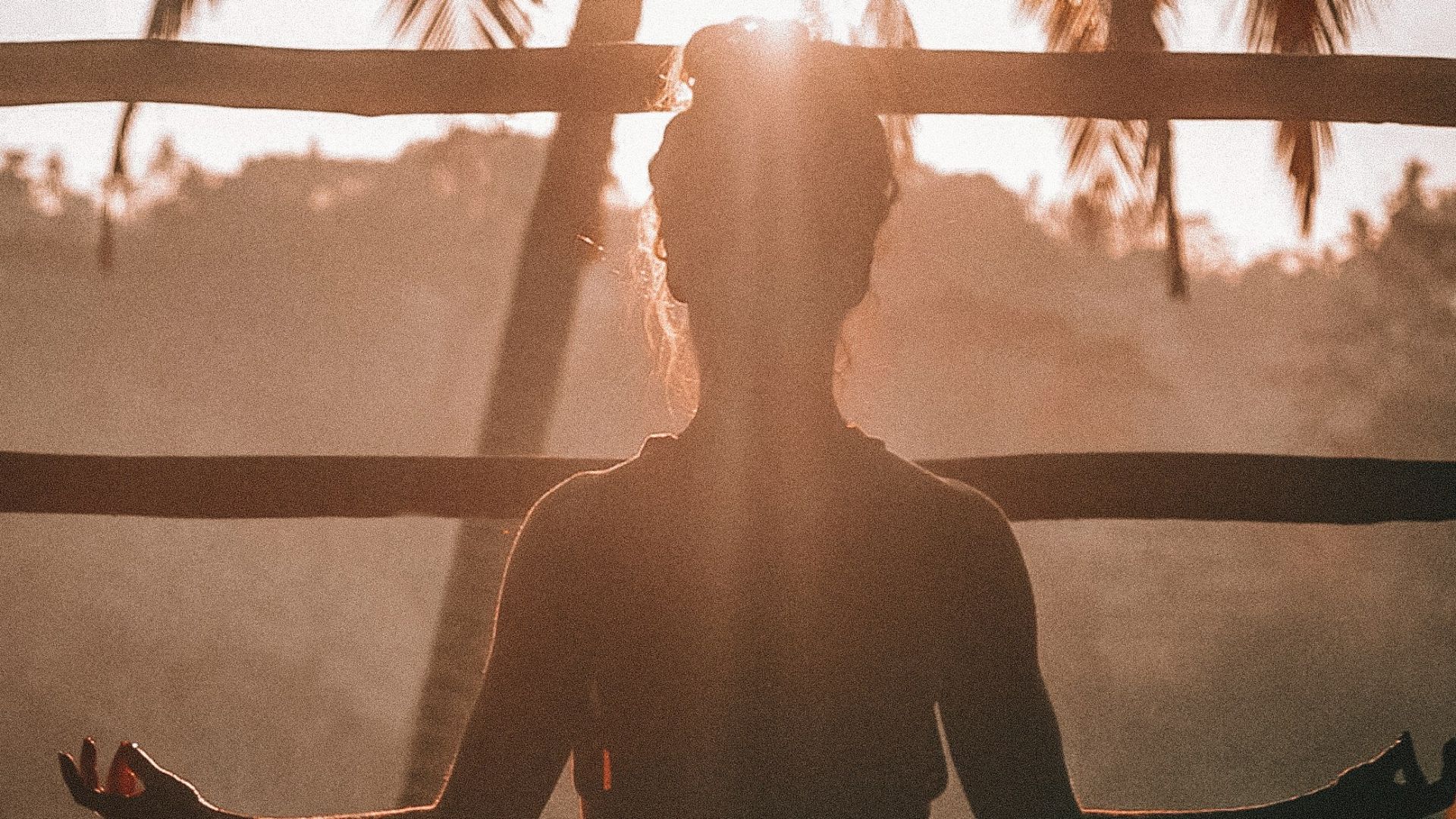 woman doing yoga meditation on brown parquet flooring