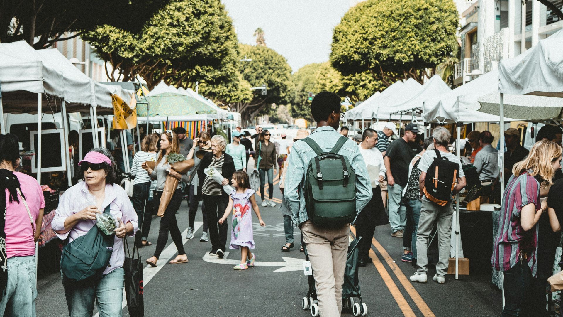 people walking on walkway during daytime