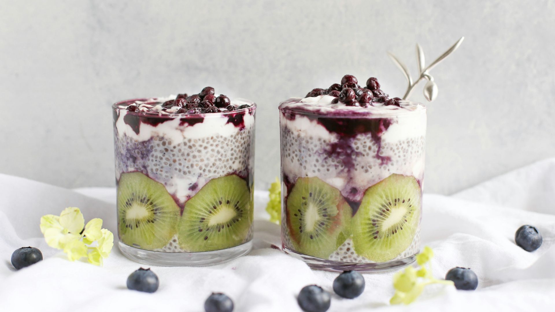 two fruit beverages on glass cups