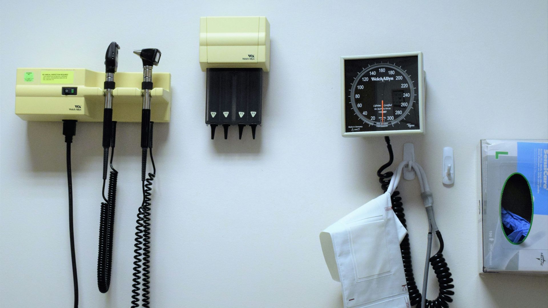 a white wall with a bunch of electrical equipment on it