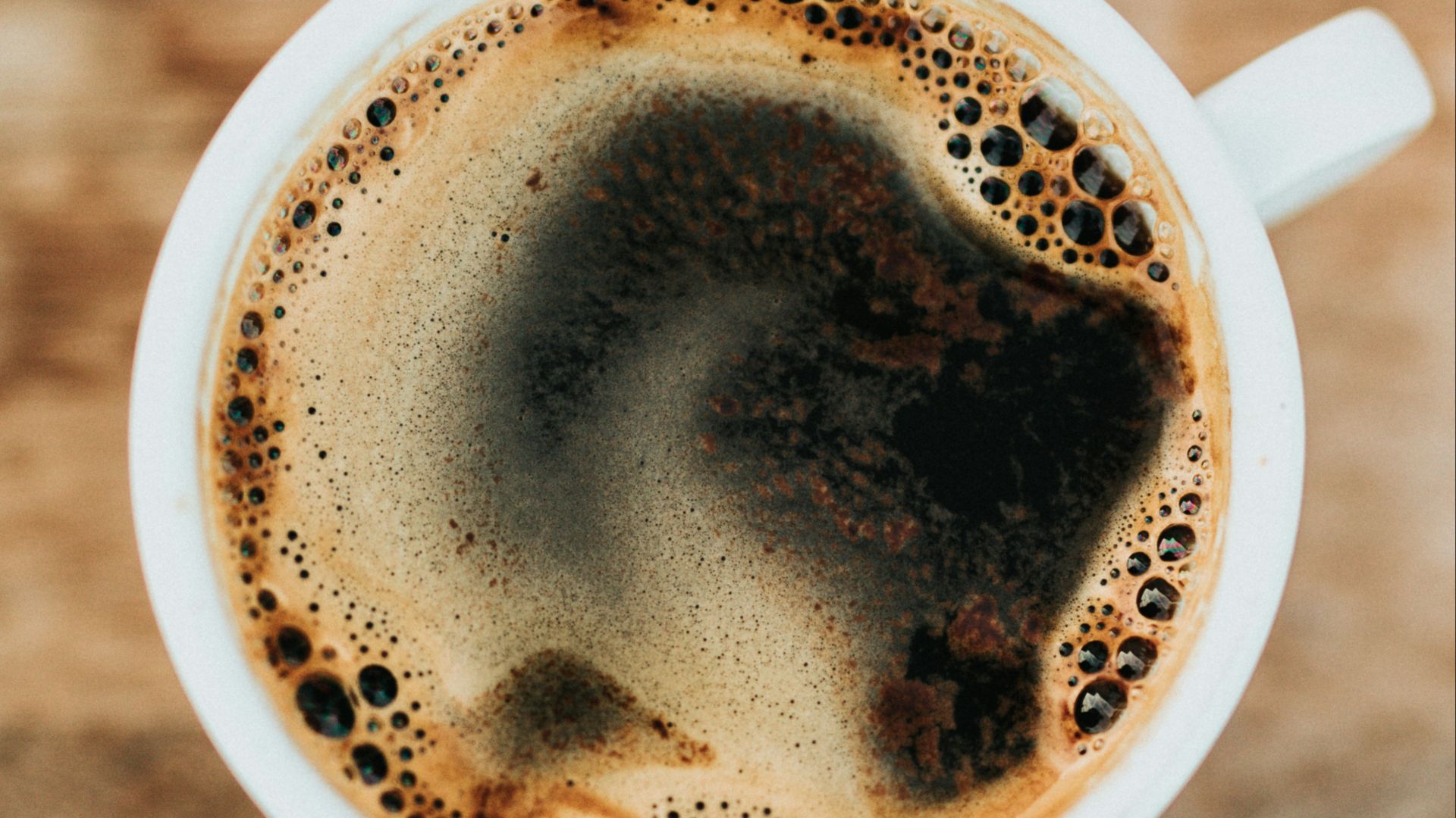 white ceramic mug filled with coffee