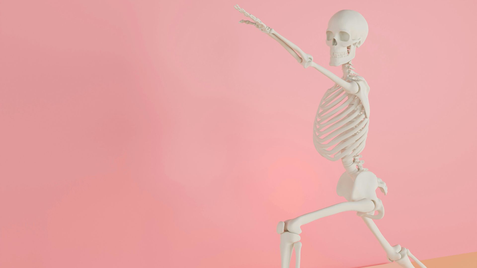a skeleton holding a tennis racquet on a pink background