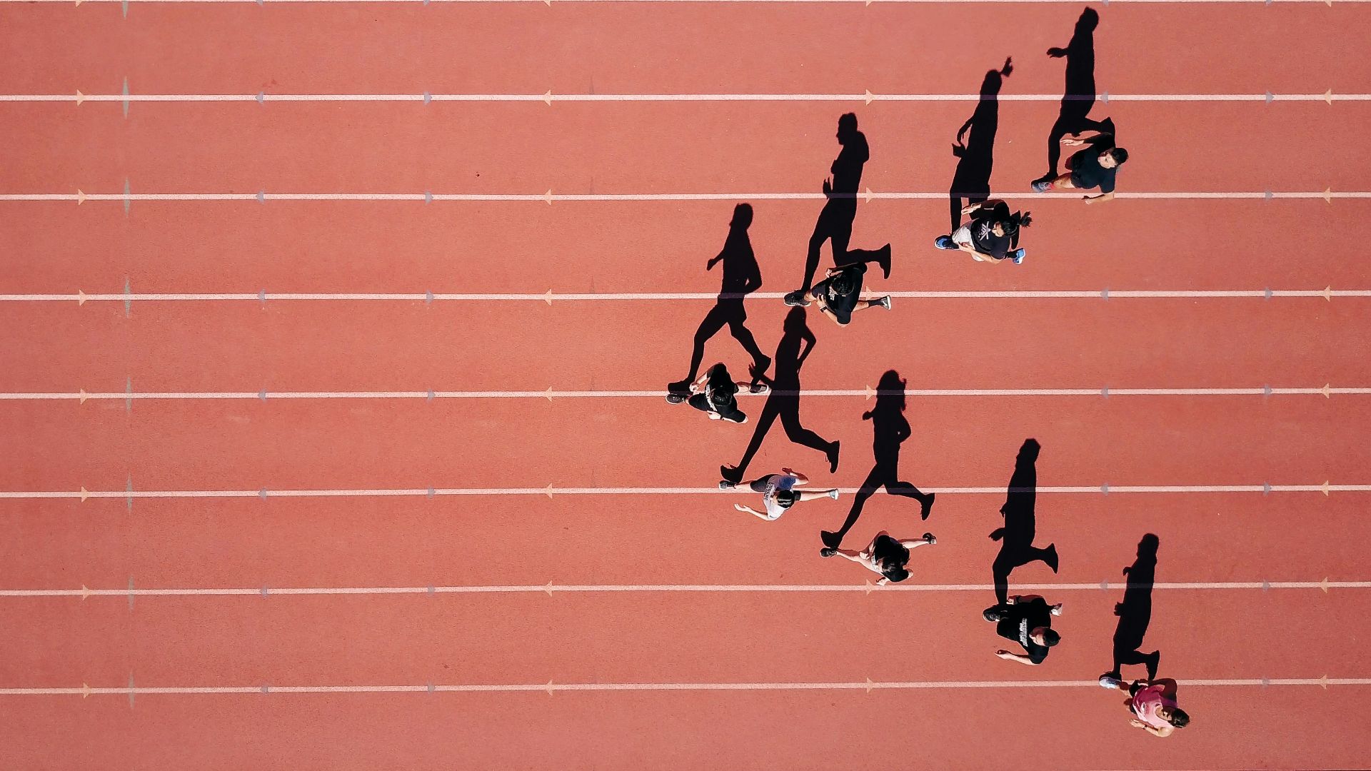group of people running on stadium
