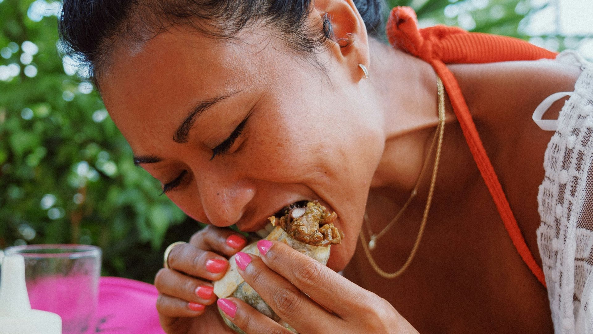woman in white lace shirt holding brown woven basket