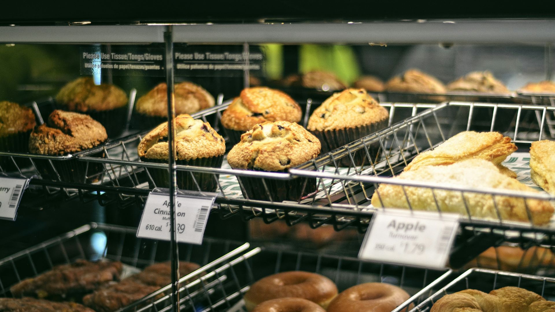a display case filled with lots of different types of doughnuts