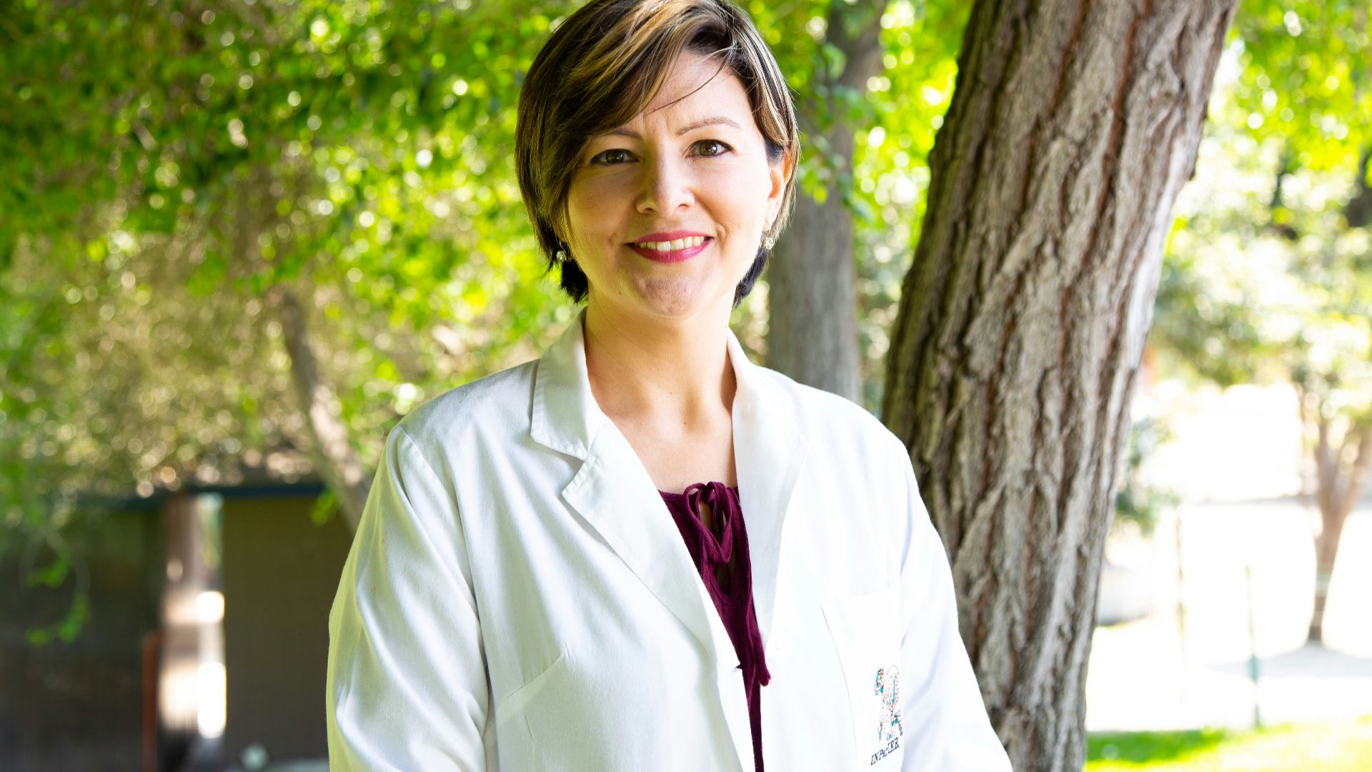woman standing under tree