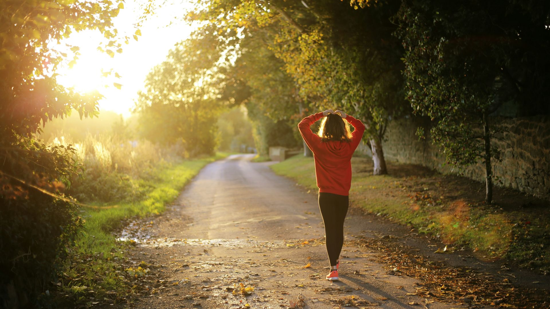 woman walking on pathway during daytime