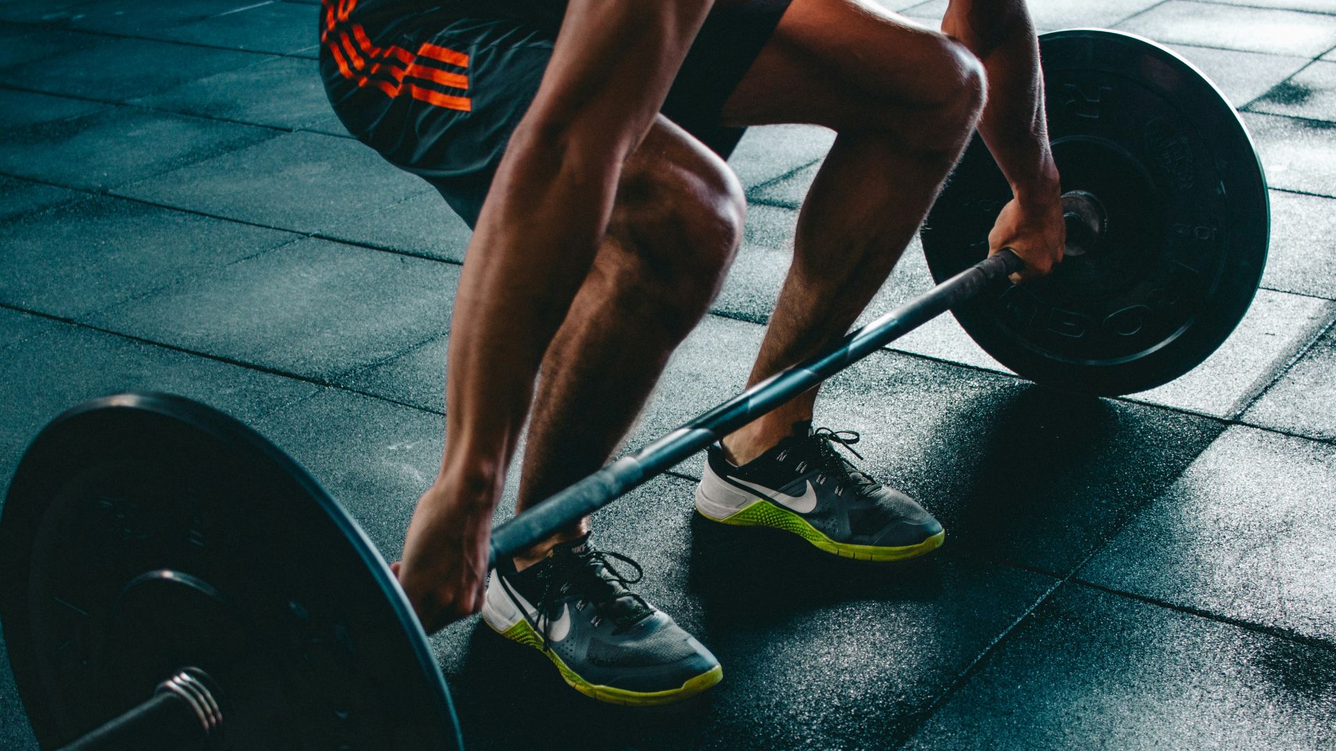person about to lift the barbel
