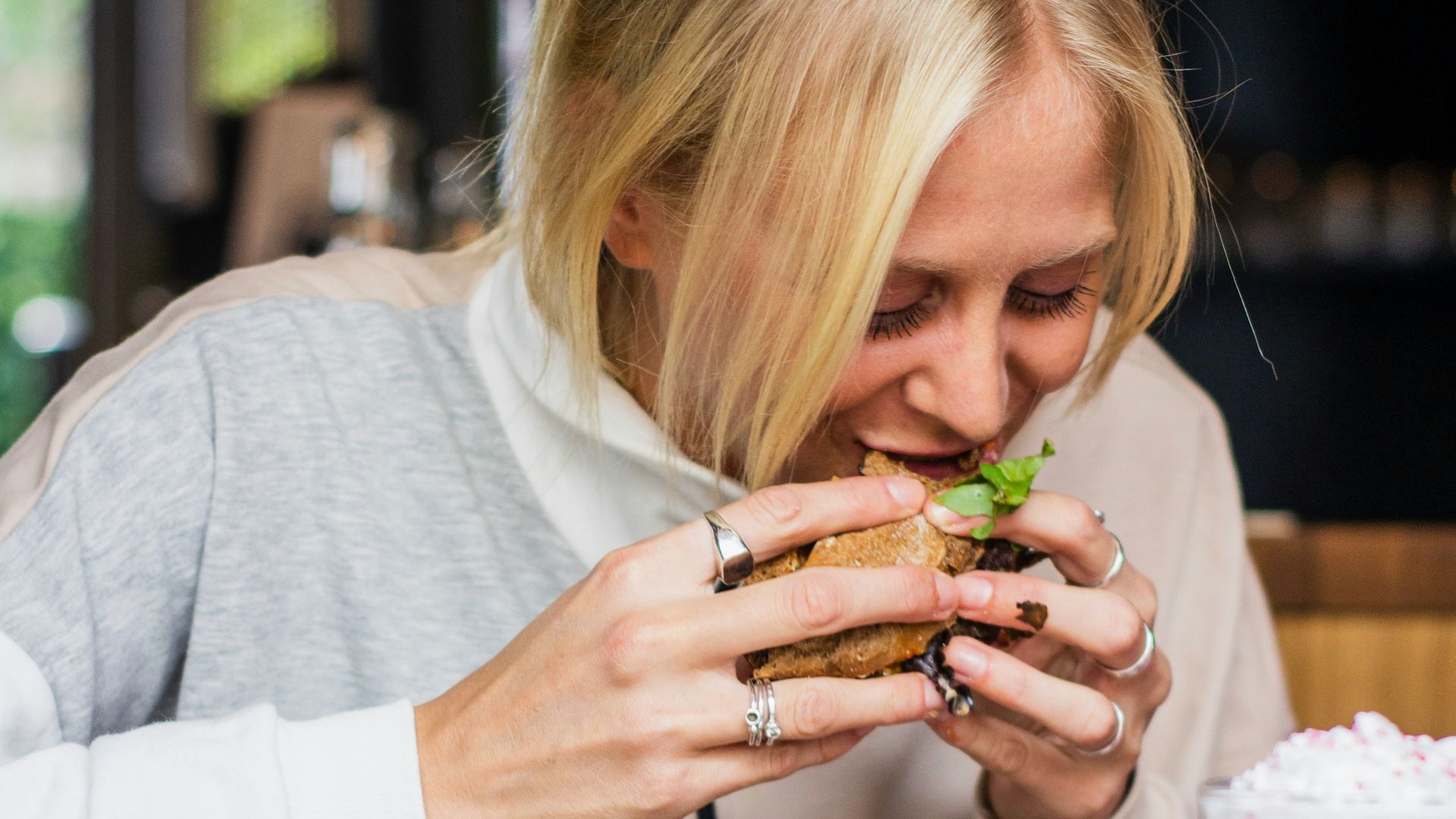 woman eating burger