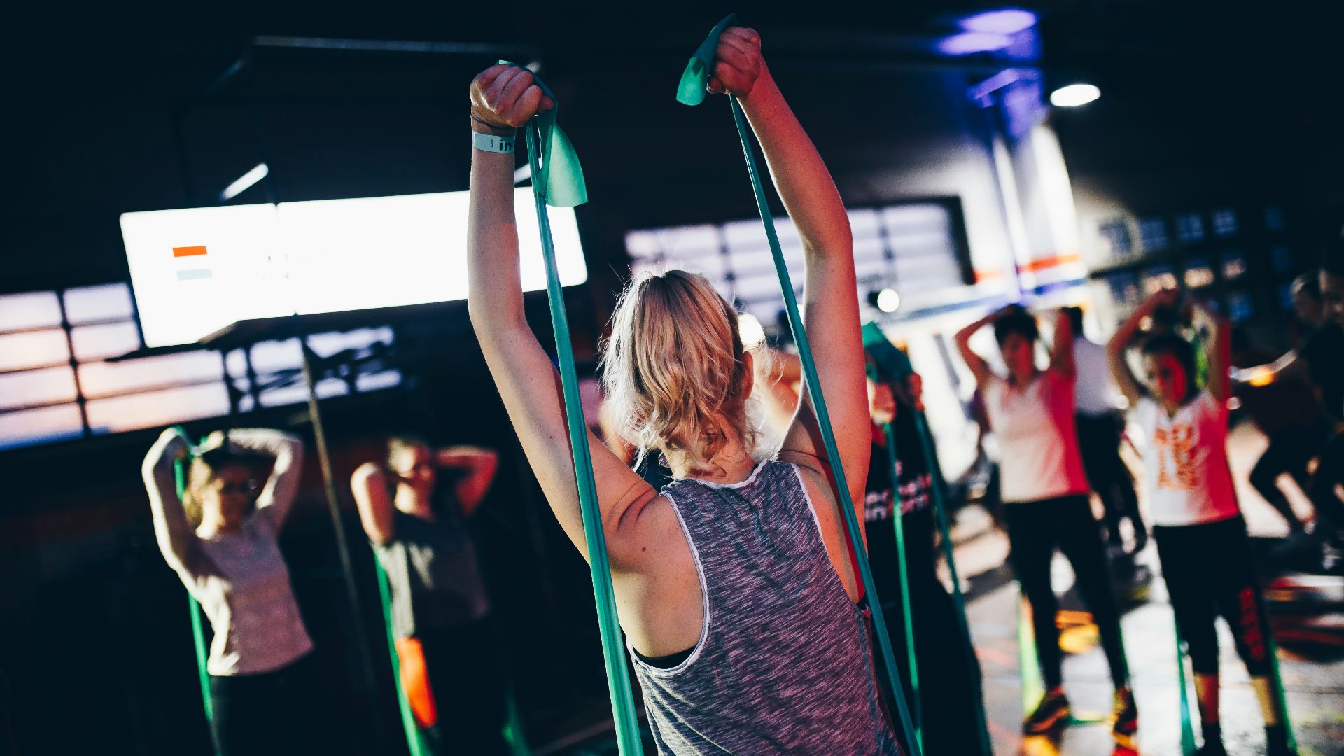 group of people in gym while exercising