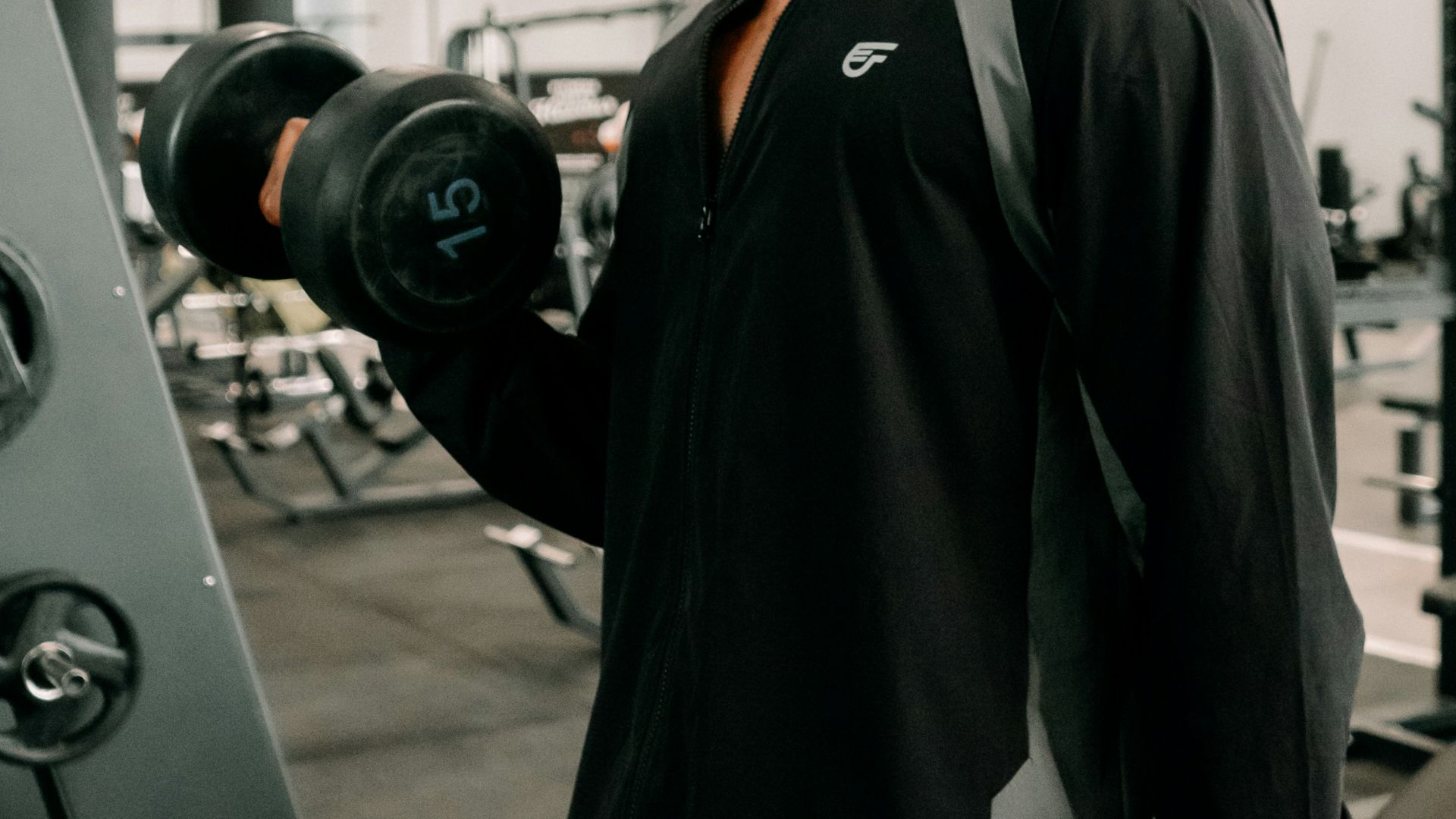 Man lifting dumbbells during a workout