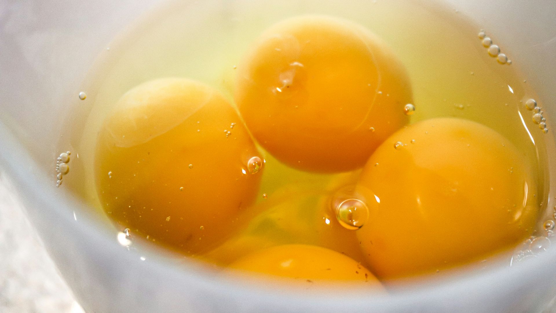 yellow liquid in white ceramic cup