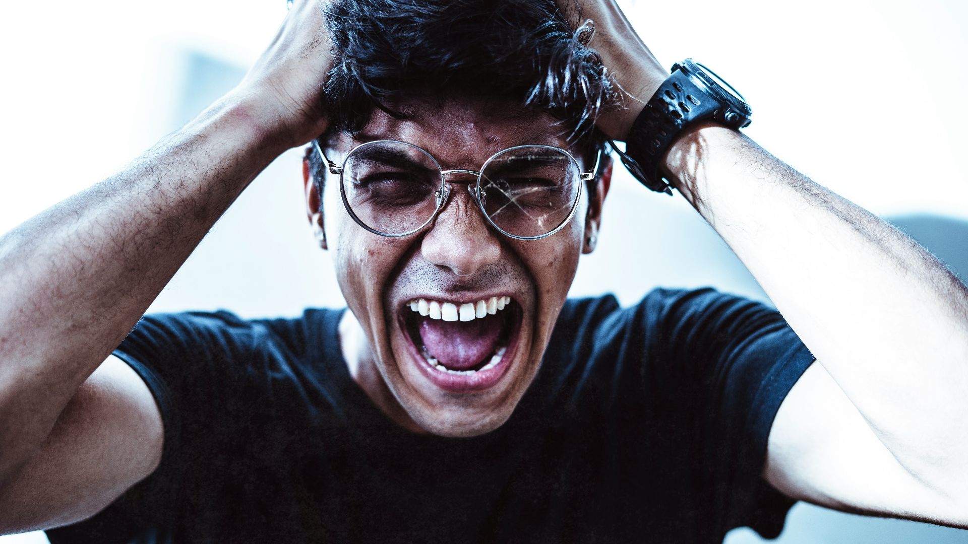 man in black crew neck t-shirt smiling