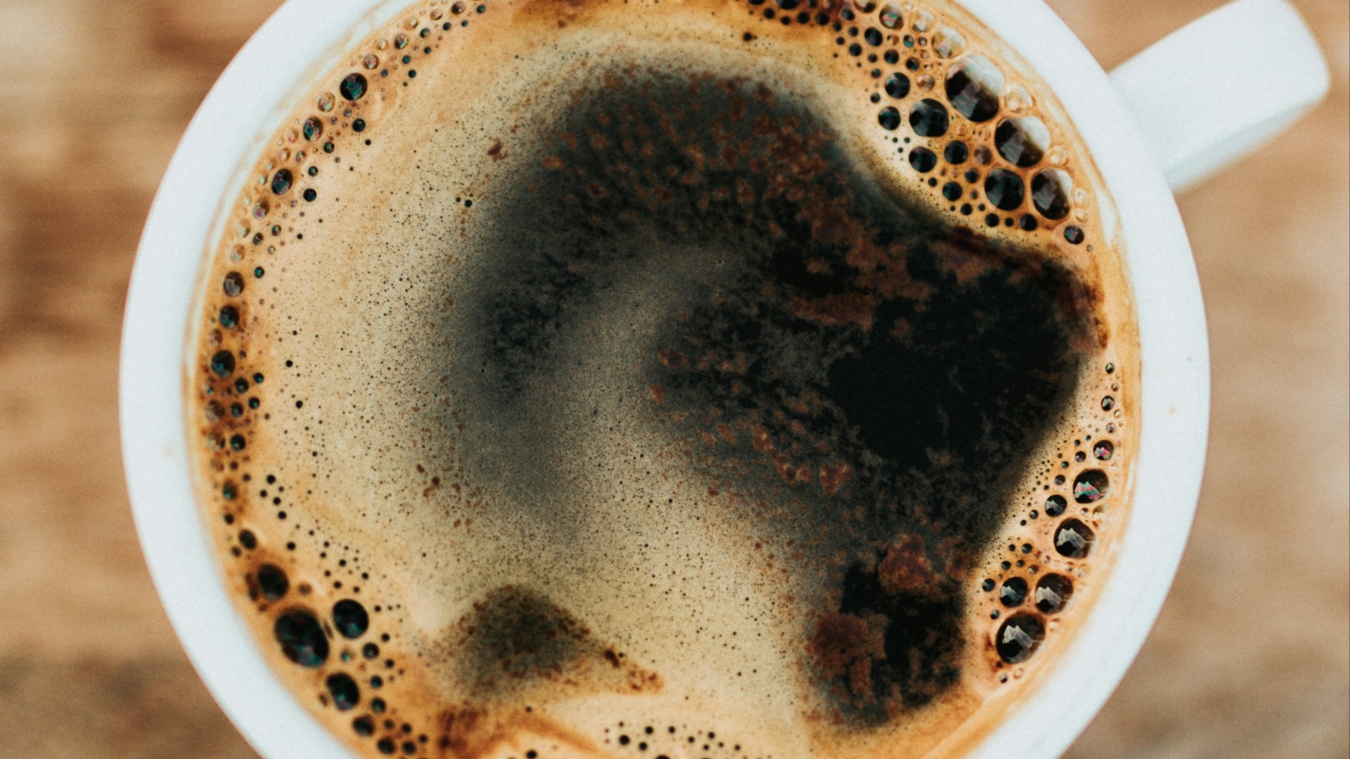 white ceramic mug filled with coffee