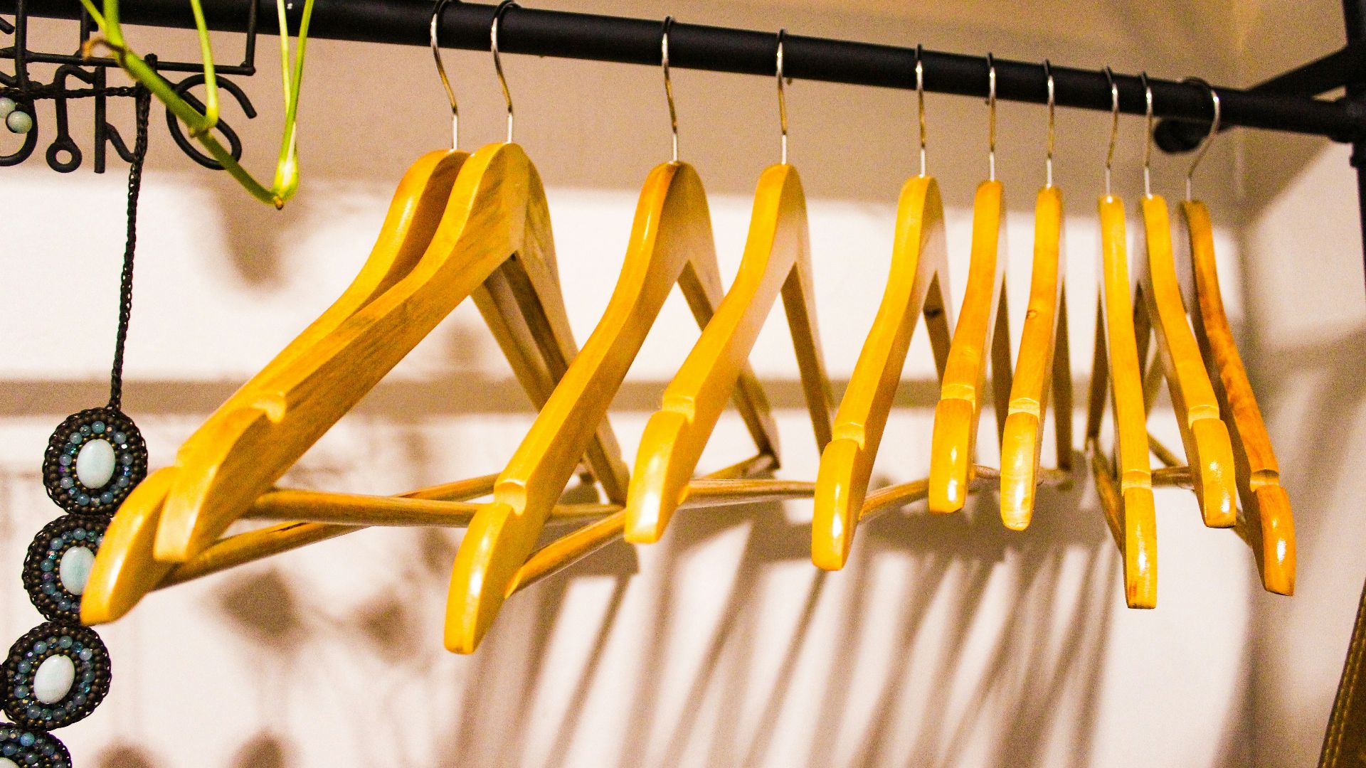 a rack of clothes hanging on a wall