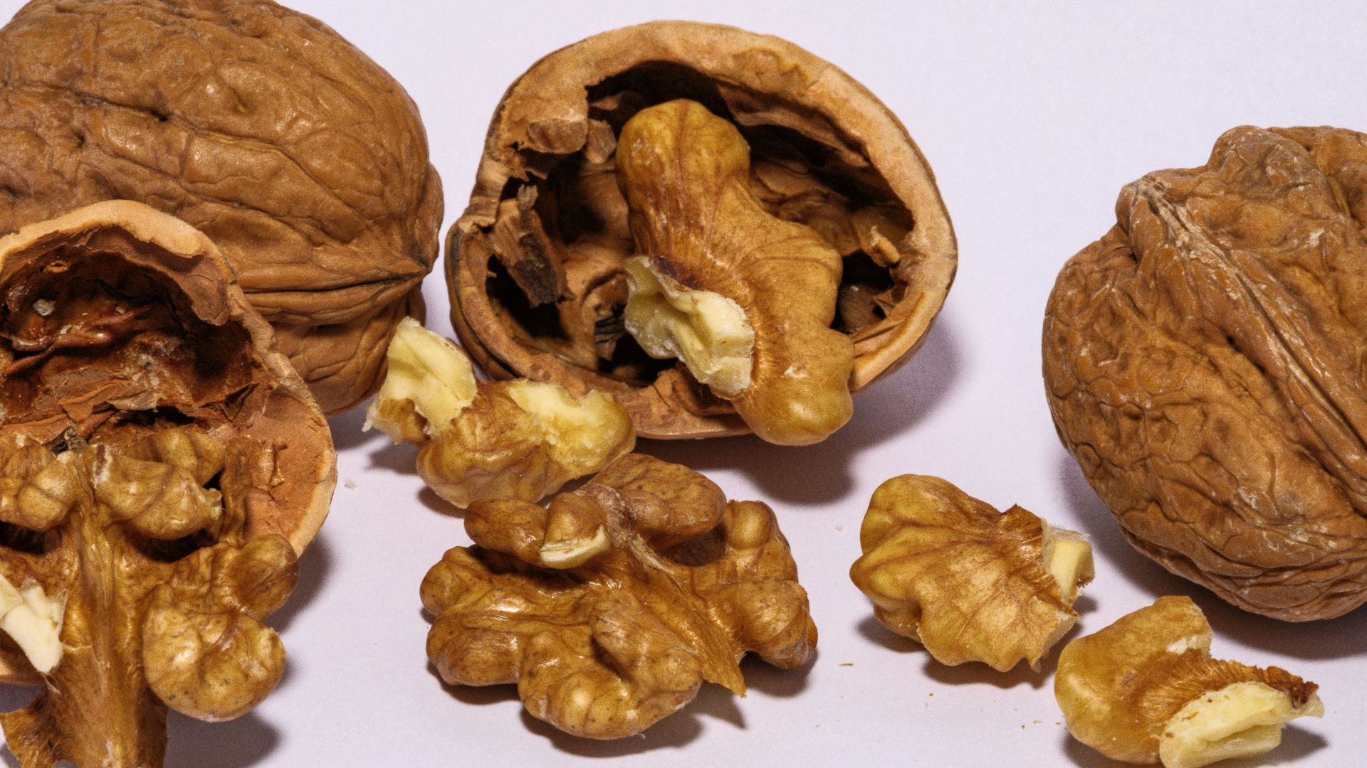 A group of walnuts sitting next to each other