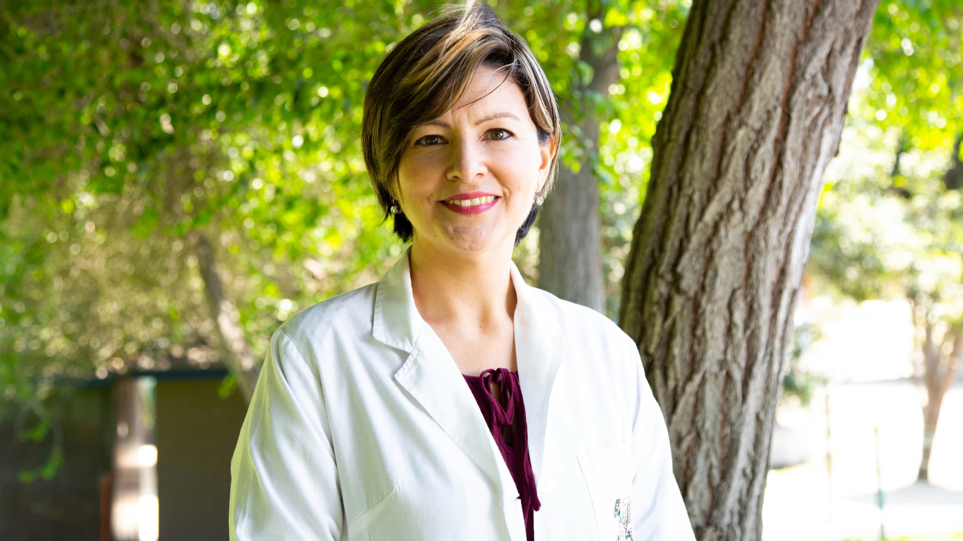 woman standing under tree