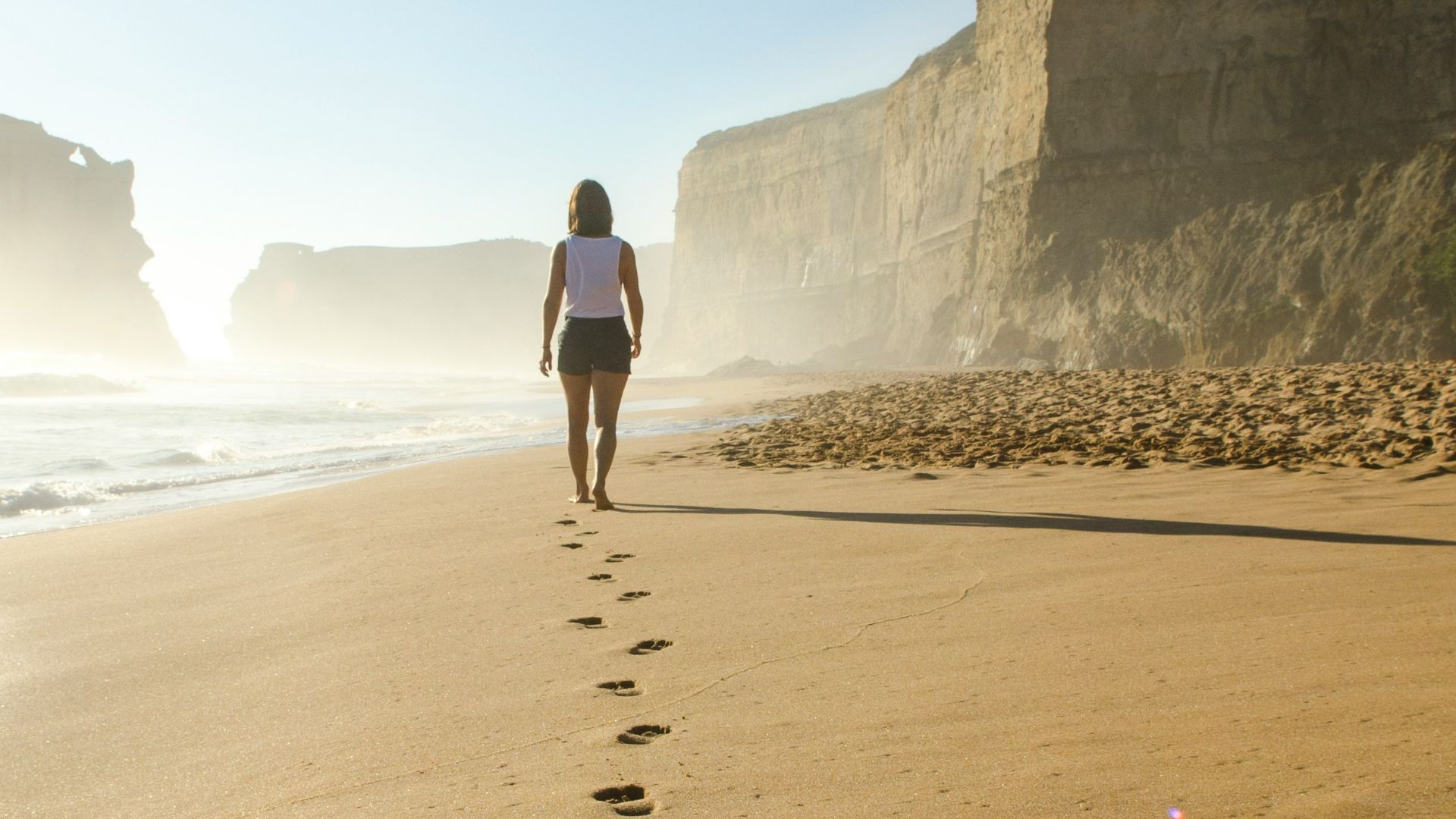 woman walking on shore