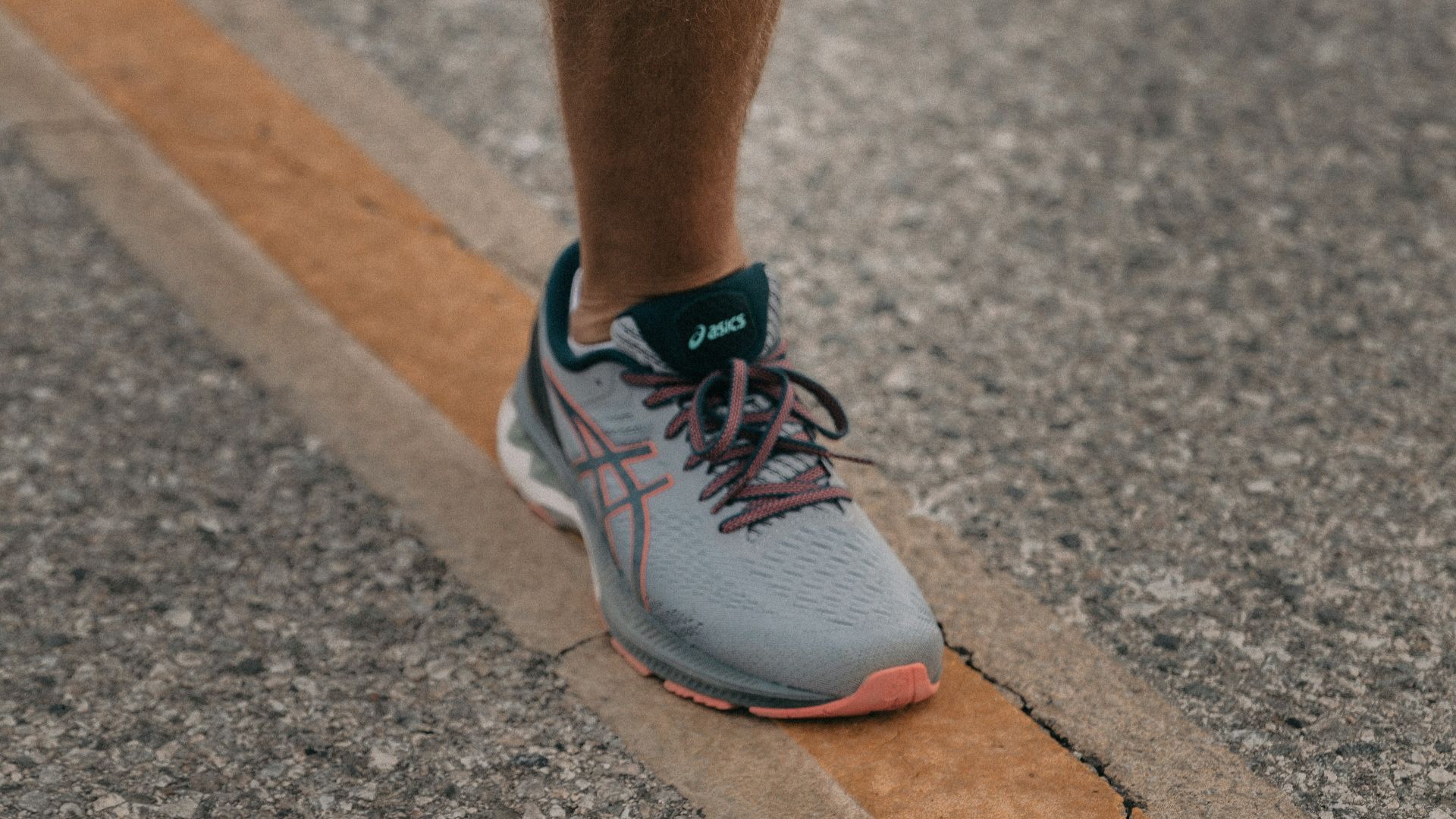 person in white nike sneakers