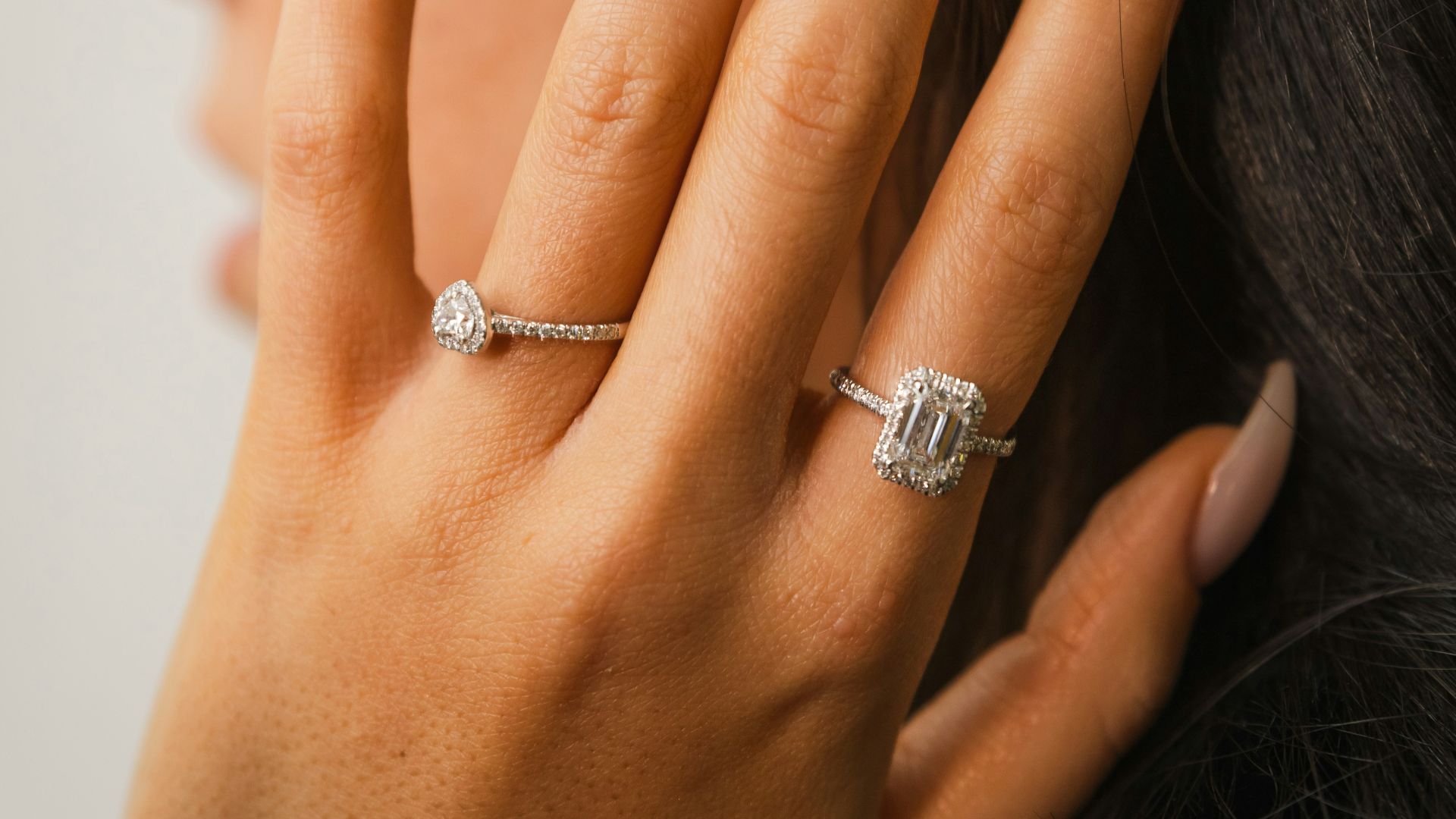Woman's hand with two diamond rings