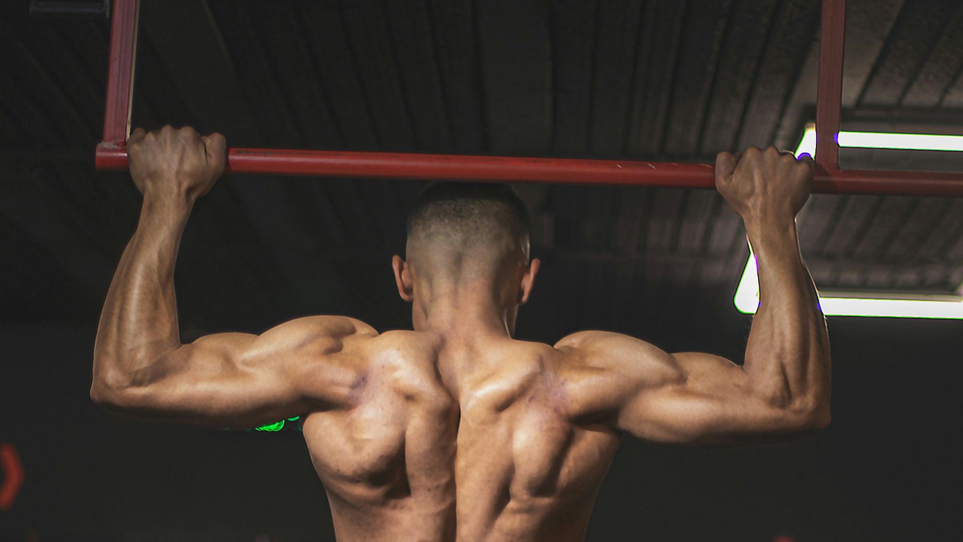 topless man in black shorts