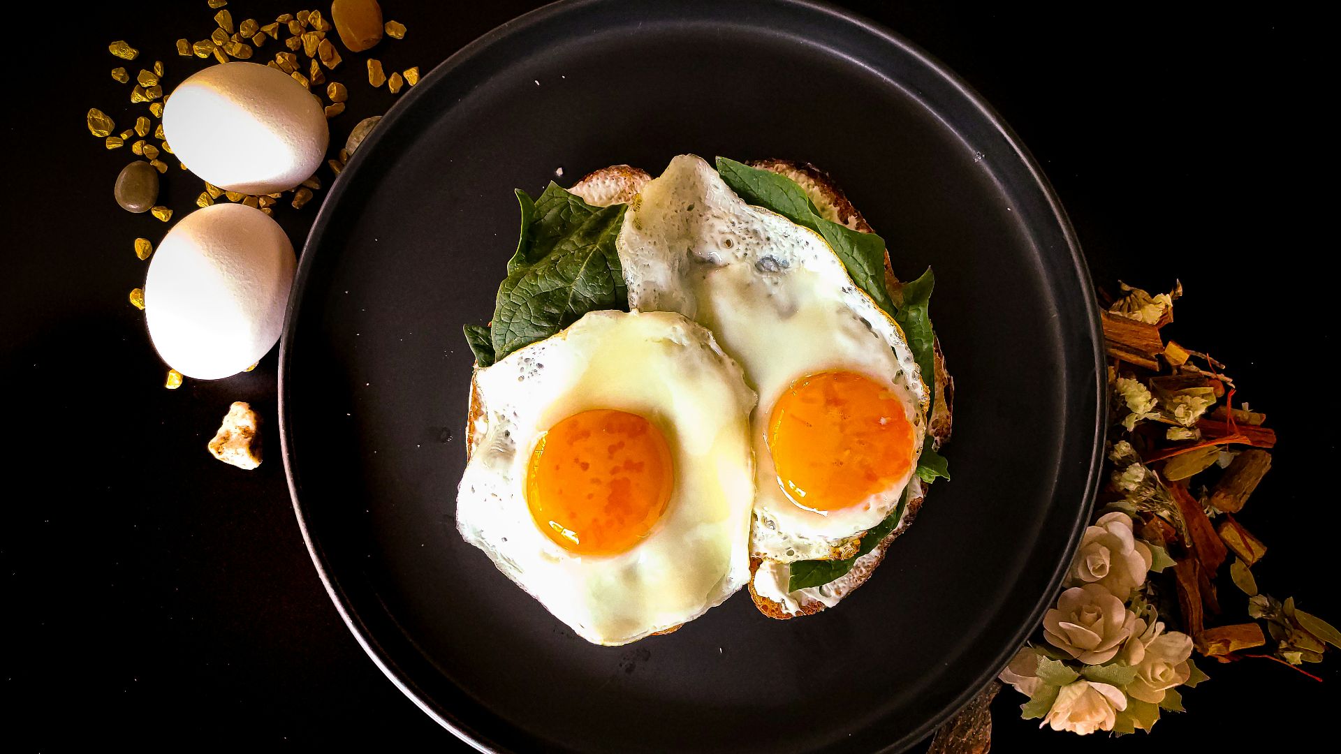 sunny side up egg on black ceramic plate