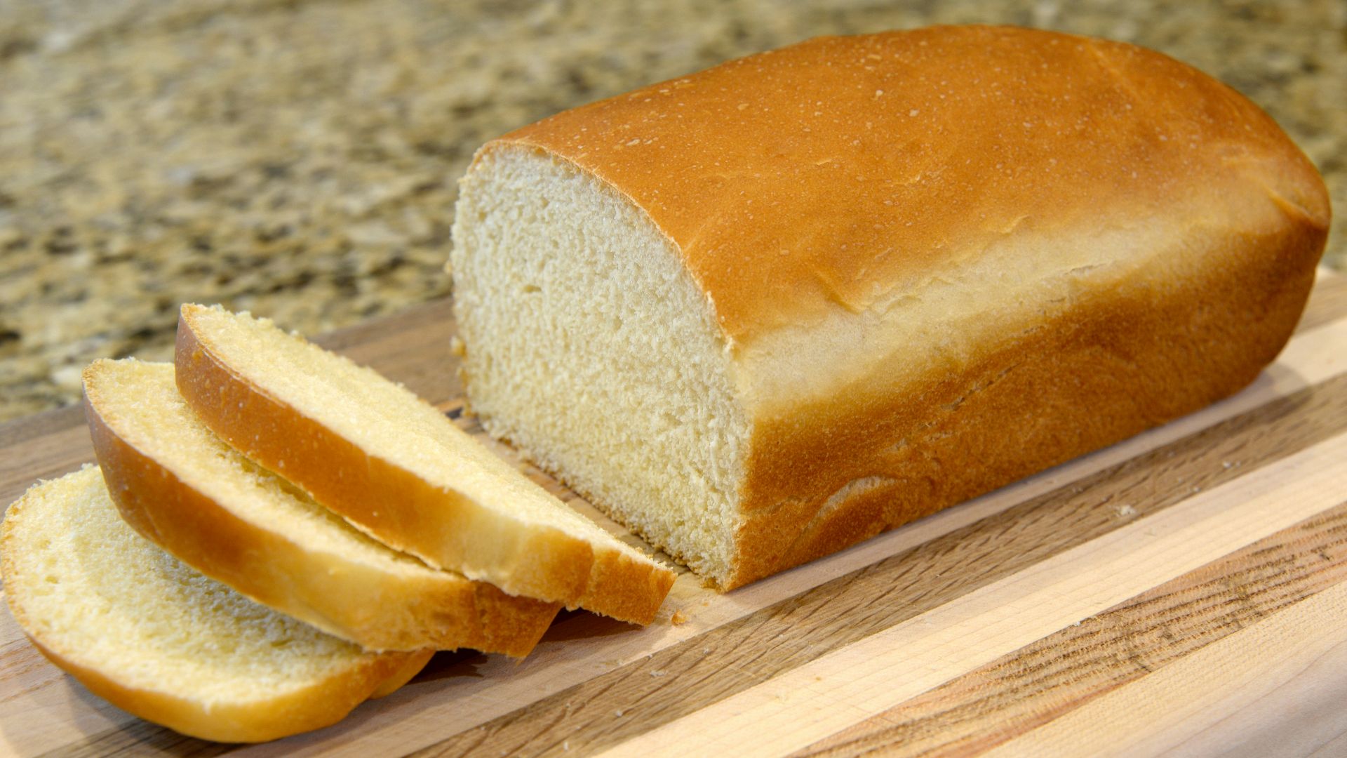 bread on brown wooden chopping board