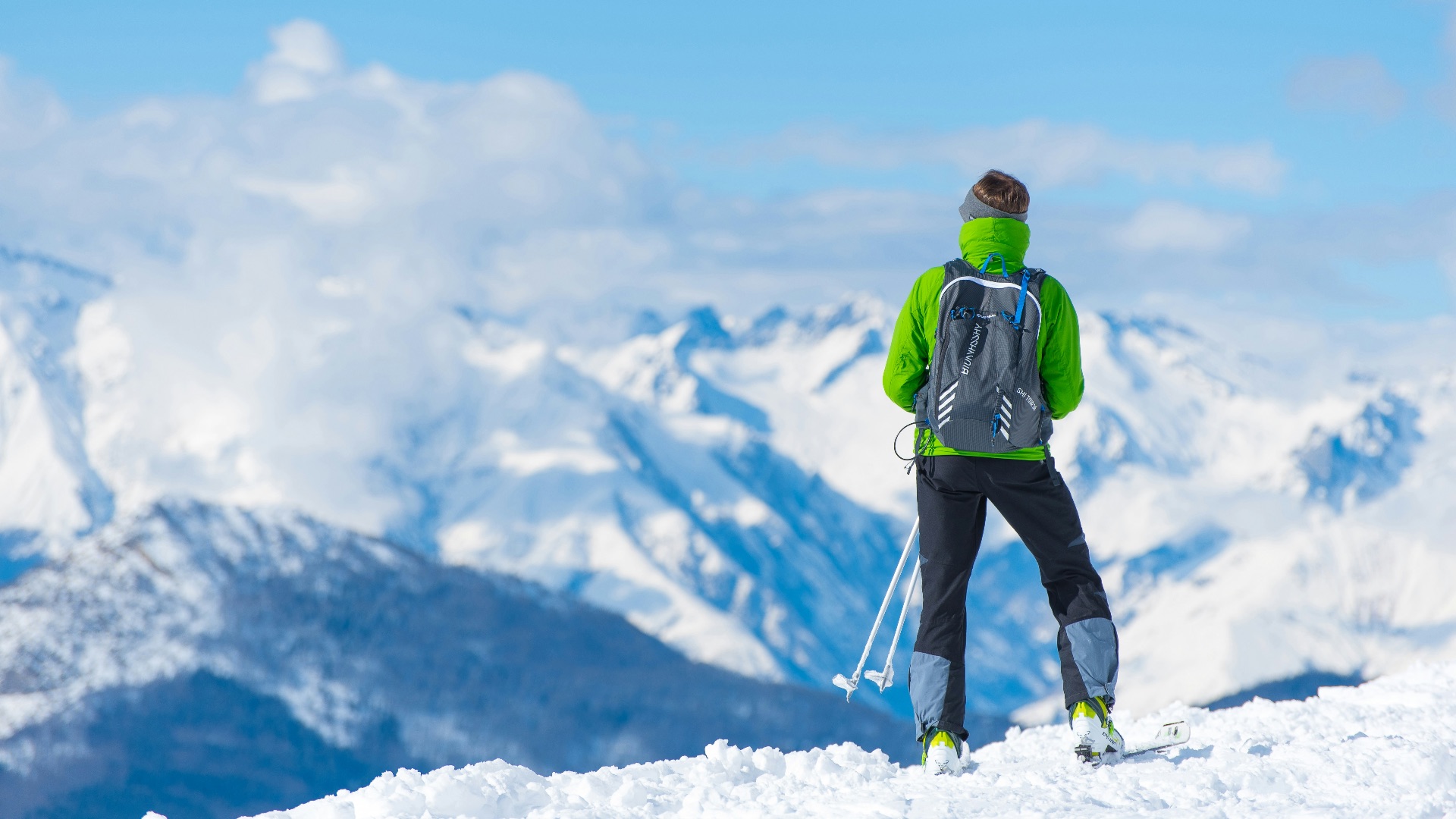 man standing on top of snow mountain