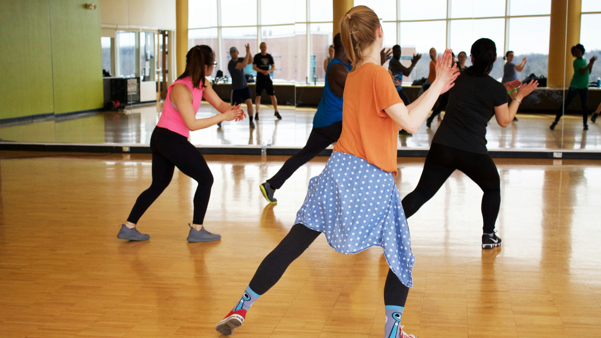 women dancing near mirror