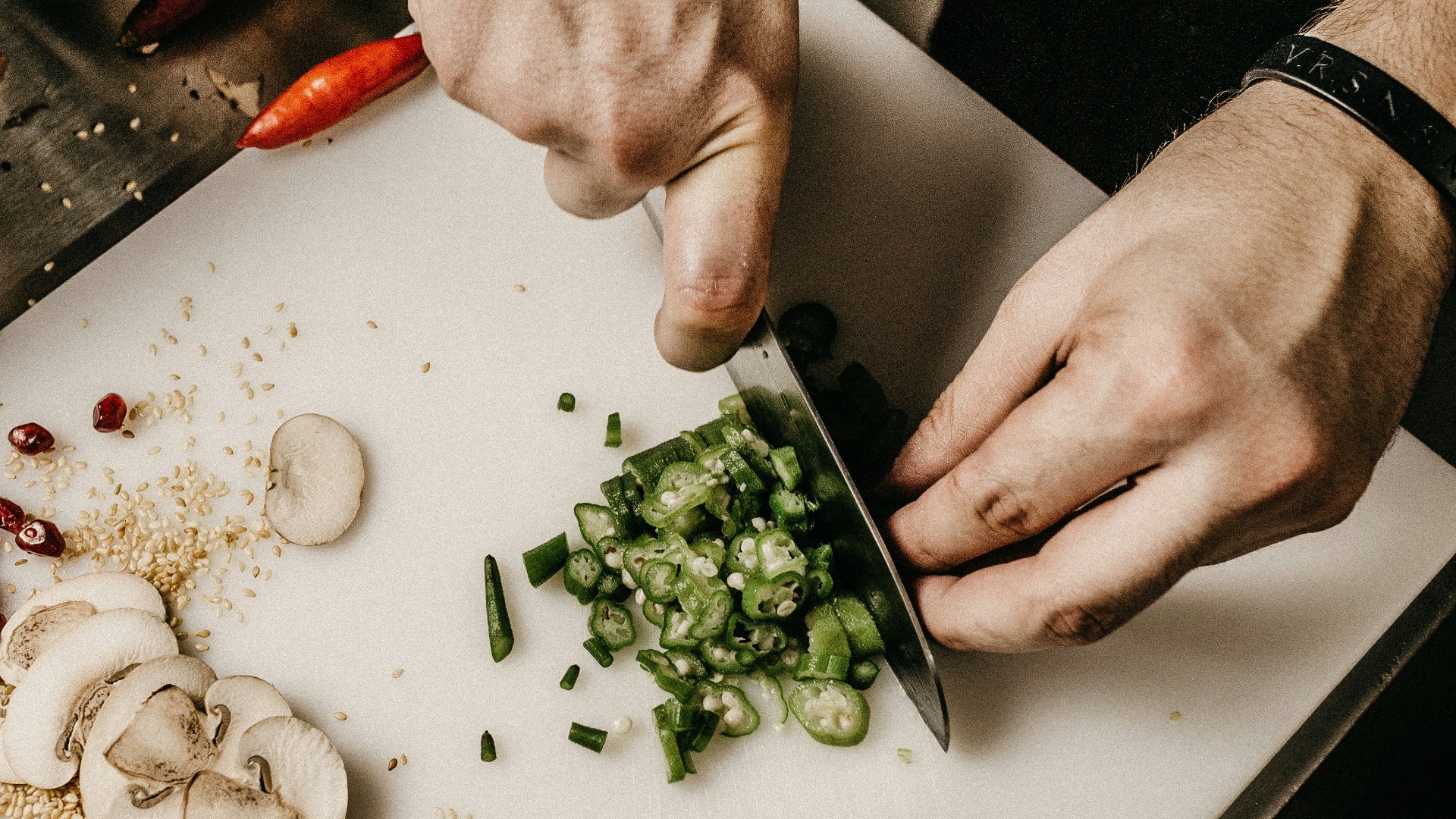 person slicing vegetable