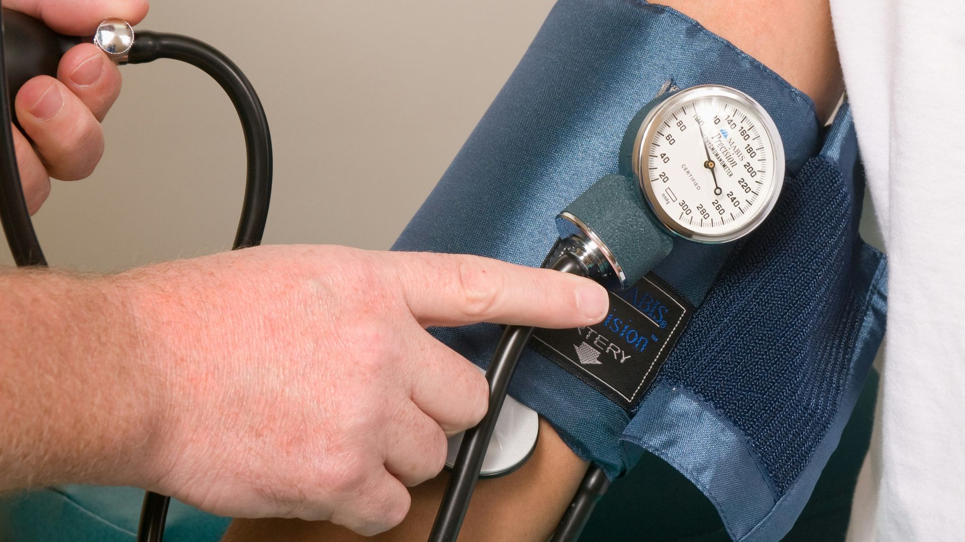 a doctor checking the blood pressure of a patient