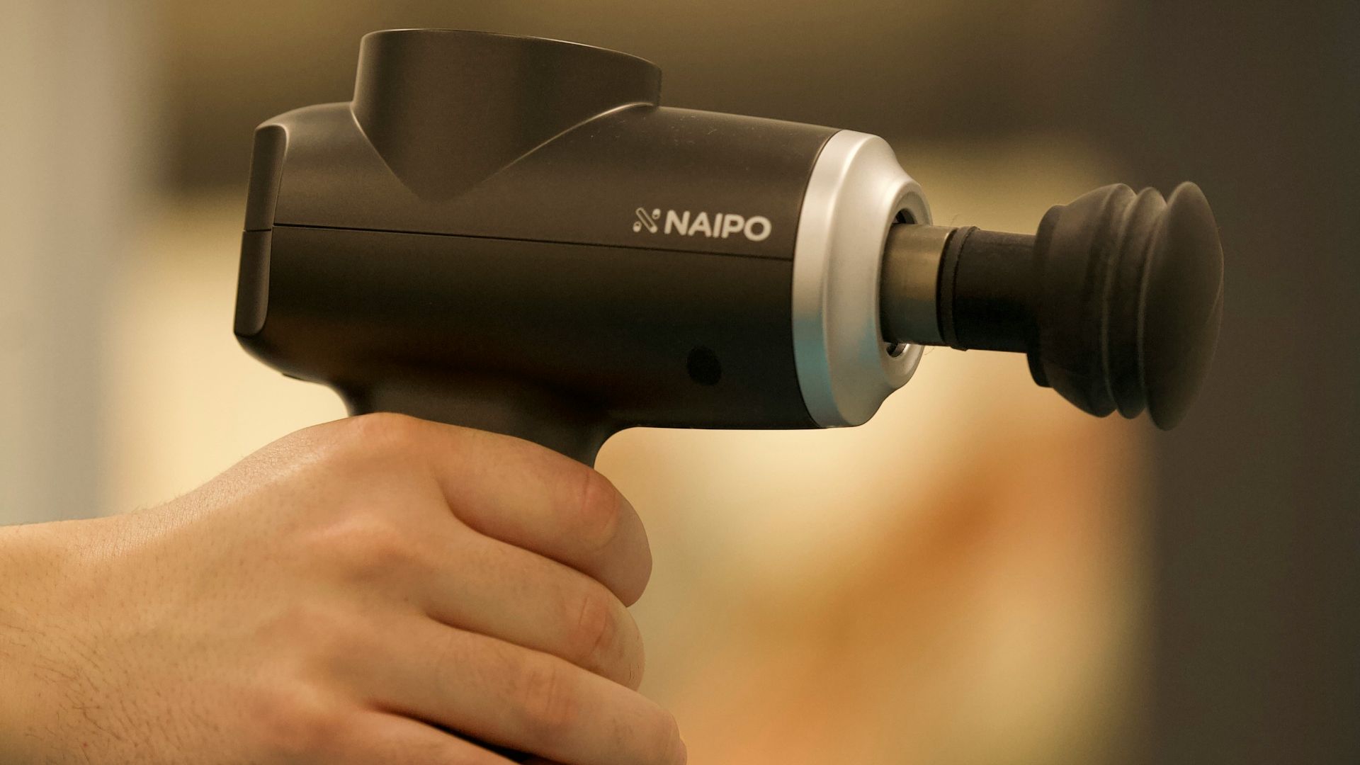 person holding black and gray cordless hand drill