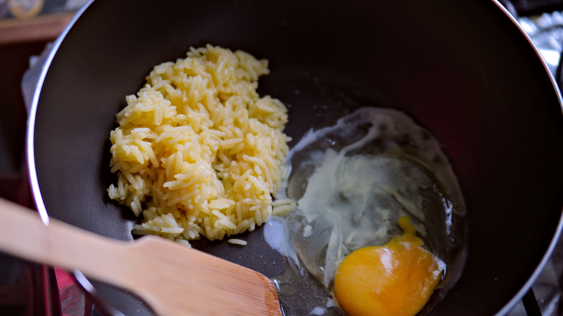 a frying pan filled with rice and an egg