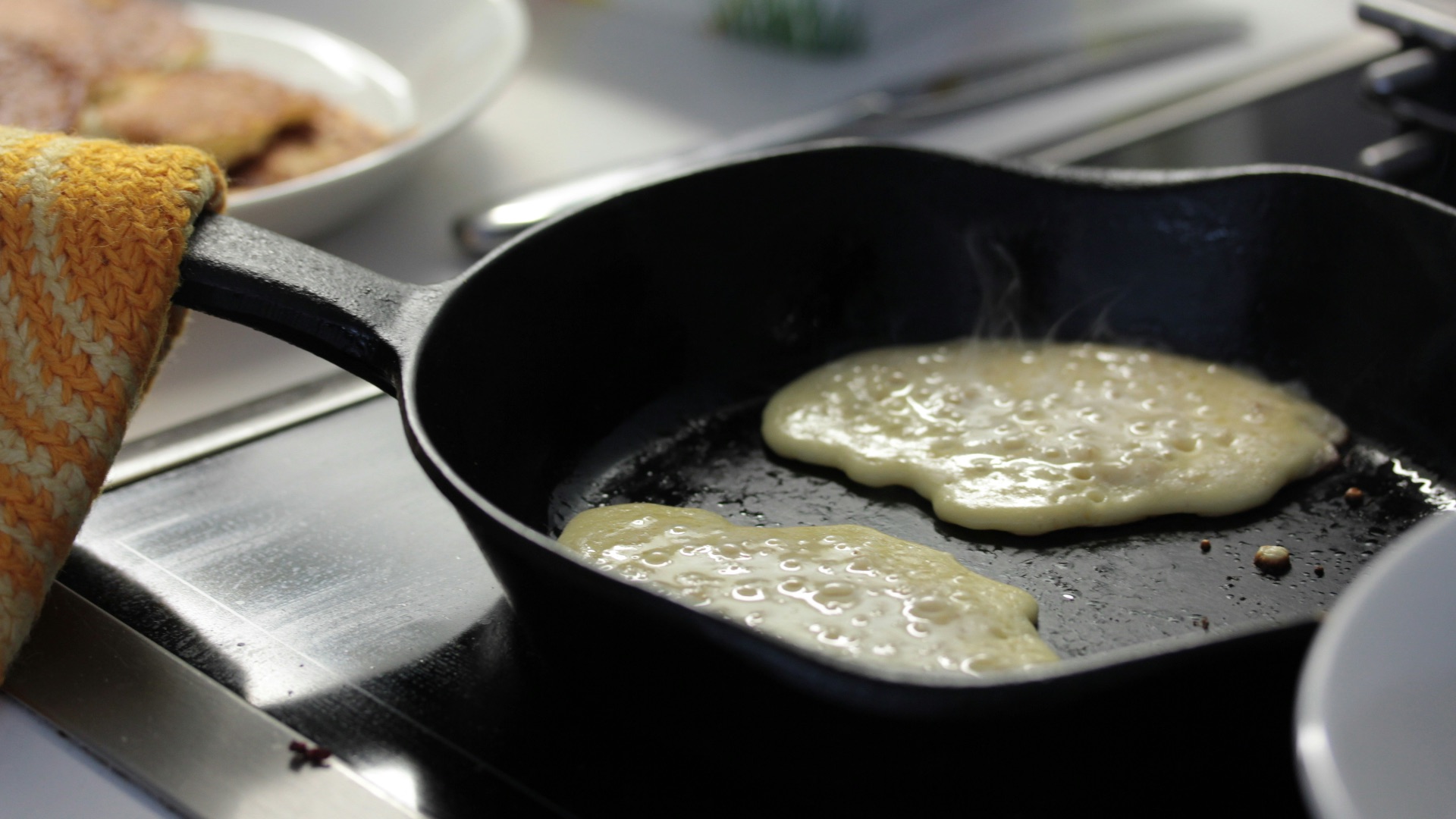 a frying pan filled with food on top of a stove