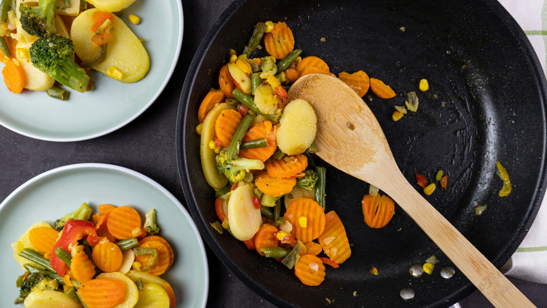 sliced vegetables on black ceramic plate