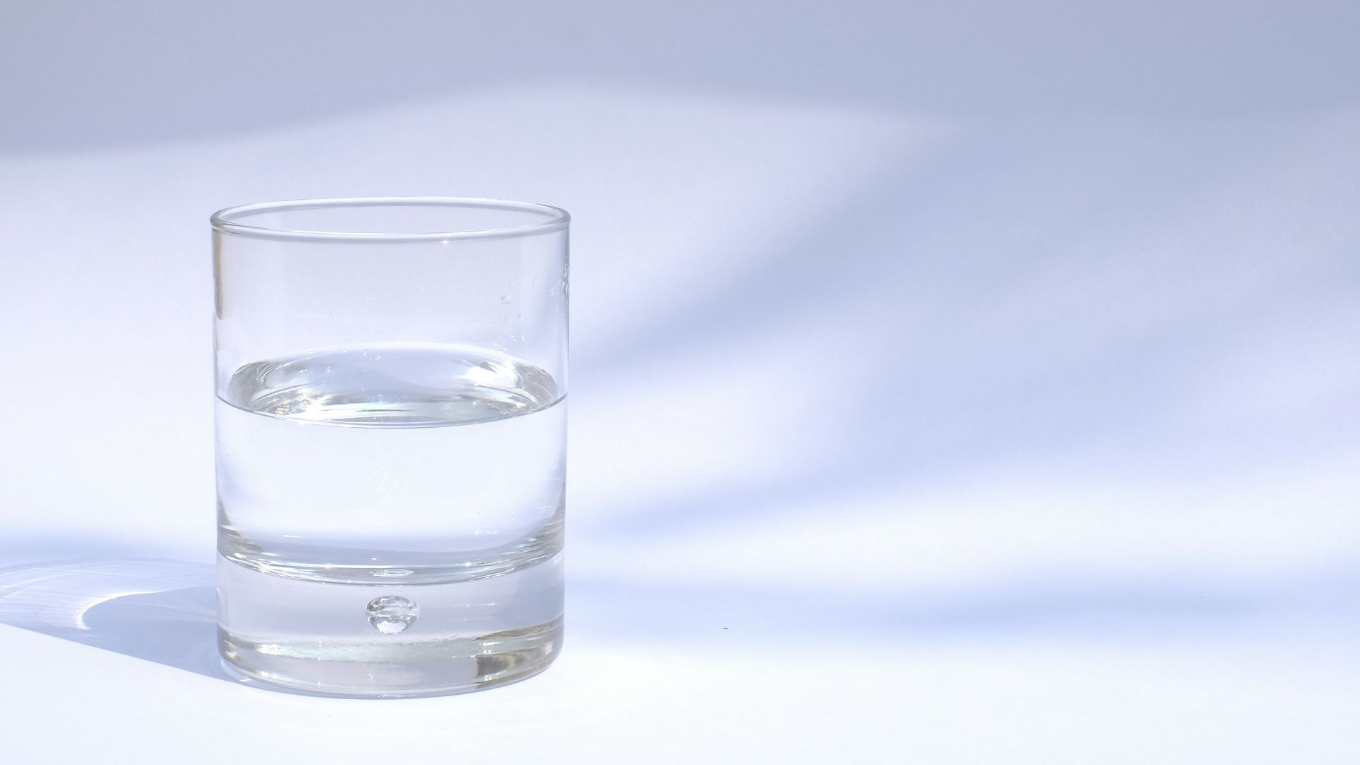 clear drinking glass filled with water