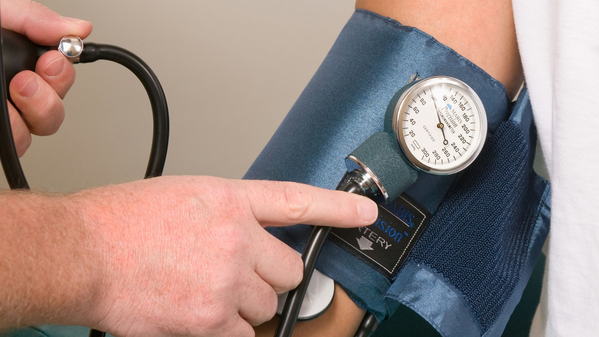 a doctor checking the blood pressure of a patient