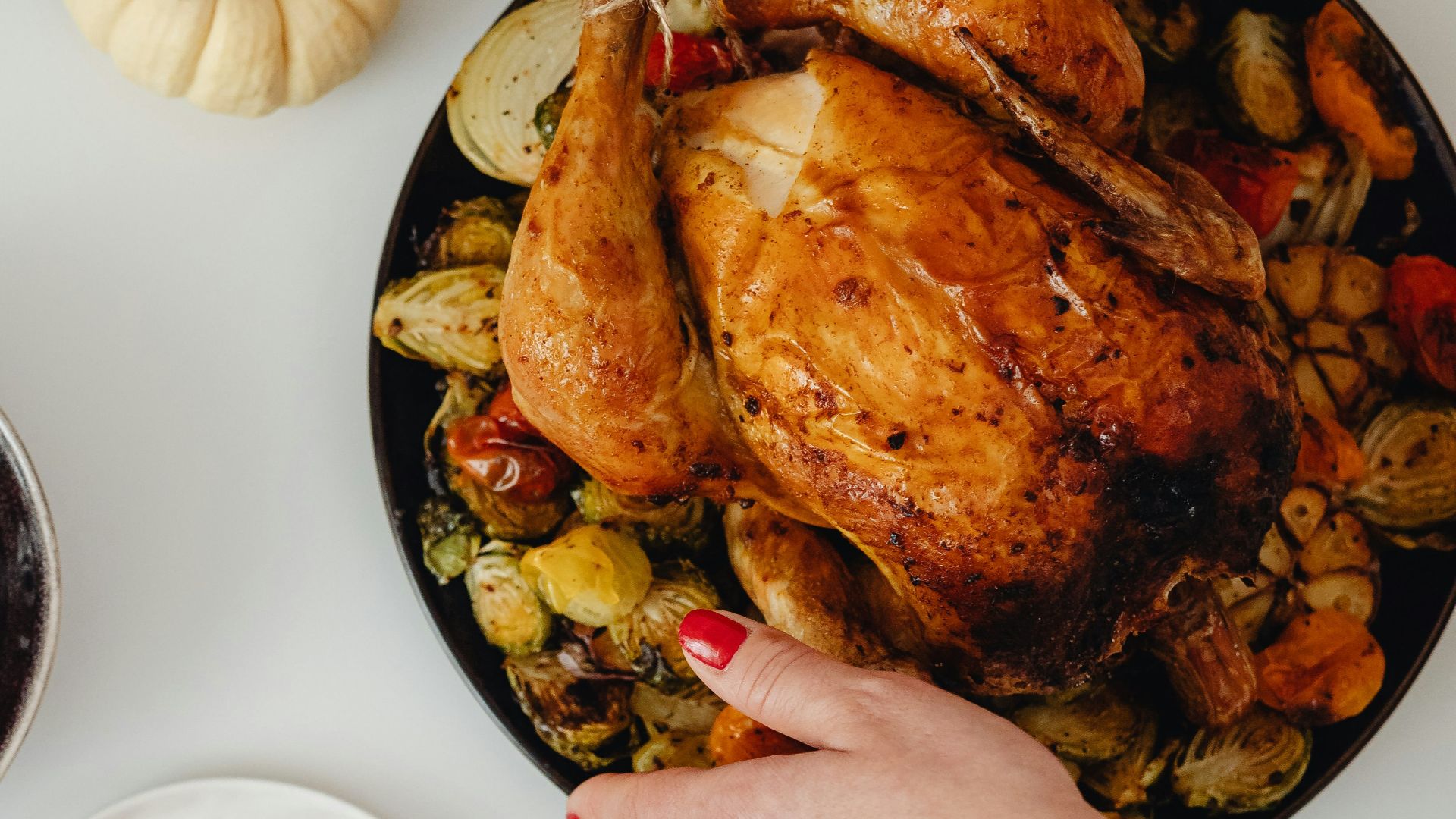 a person holding a plate of food